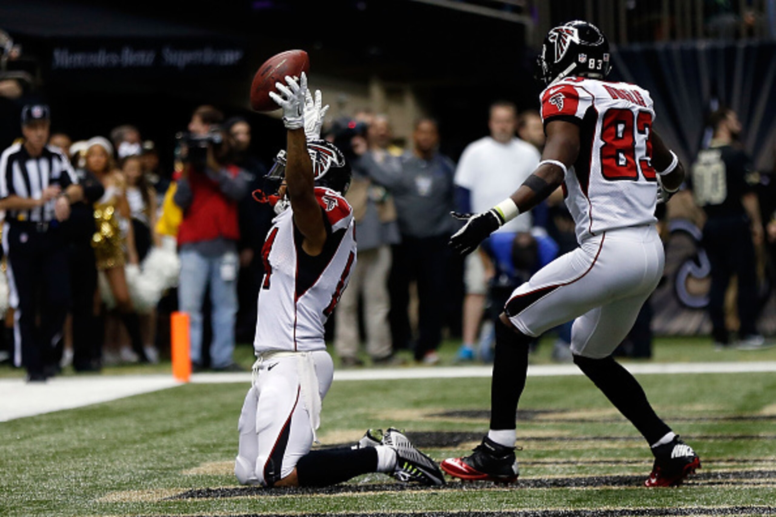 NEW ORLEANS, LA - DECEMBER 21:  Eric Weems #14 and Harry Douglas #83 of the Atlanta Falcons celebrate a touchdown against the New Orleans Saints during the second quarter of a game at the Mercedes-Benz Superdome on December 21, 2014 in New Orleans, Louisi