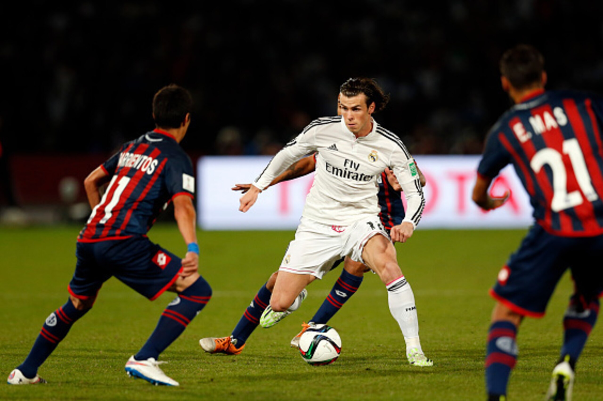 MARRAKECH, MOROCCO - DECEMBER 20: Gareth Bale of Real Madrid CF takes on the San Lorenzo defence during the FIFA Club World Cup Final match between Real Madrid CF and San Lorenzo at Le Grand Stade de Marrakech on December 20, 2014 in Marrakech, Morocco.  