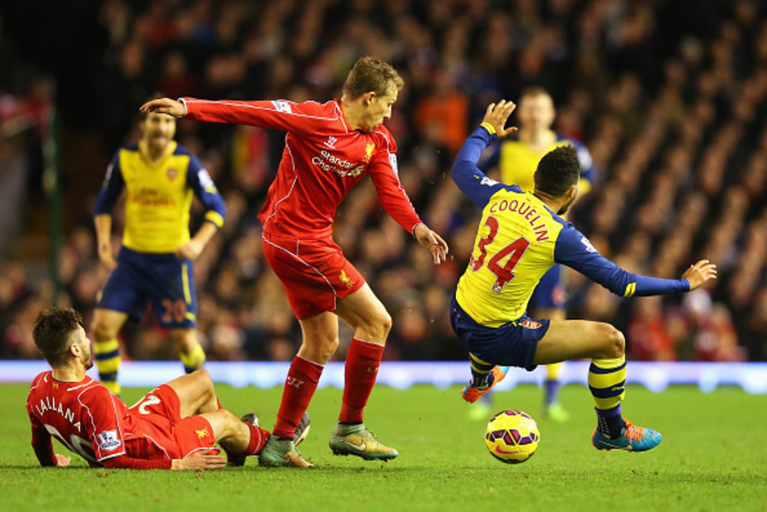 LIVERPOOL, ENGLAND - DECEMBER 21: Lucas Leiva of Liverpool challenges Francis Coquelin of Arsenal during the Barclays Premier League match between Liverpool and Arsenal at Anfield on December 21, 2014 in Liverpool, England. (Photo by Alex Livesey/Getty I LIVERPOOL, ENGLAND - DECEMBER 21: Lucas Leiva of Liverpool challenges Francis Coquelin of Arsenal during the Barclays Premier League match between Liverpool and Arsenal at Anfield on December 21, 2014 in Liverpool, England. (Photo by Alex Livesey/Getty I