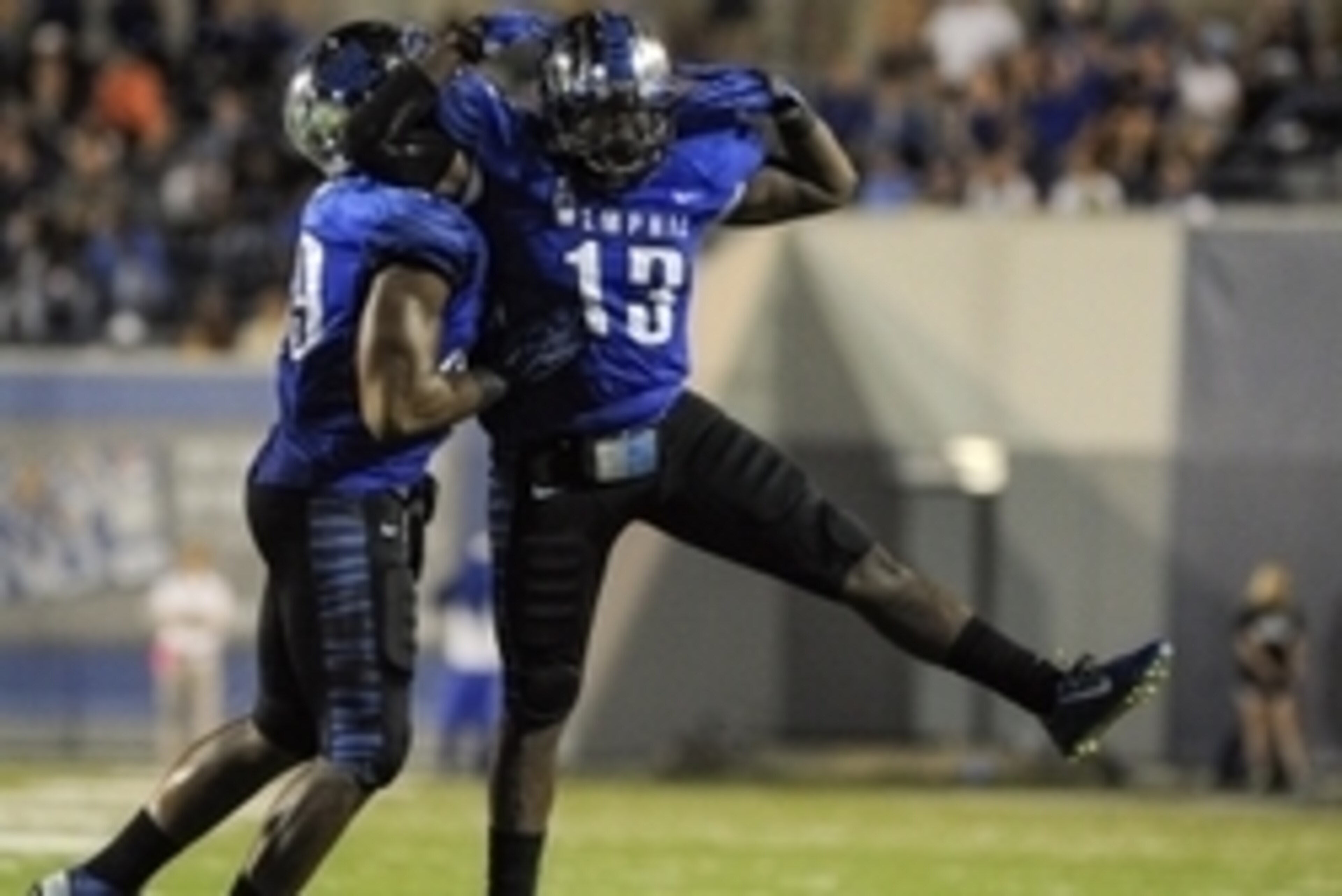 Sep 20, 2014; Memphis, TN, USA; Memphis Tigers linebacker Tank Jakes (13) reacts to intercepting a pass thrown by Middle Tennessee Blue Raiders quarterback Austin Grammer (2) during the game at Liberty Bowl Memorial Stadium. Memphis Tigers beat the Middle