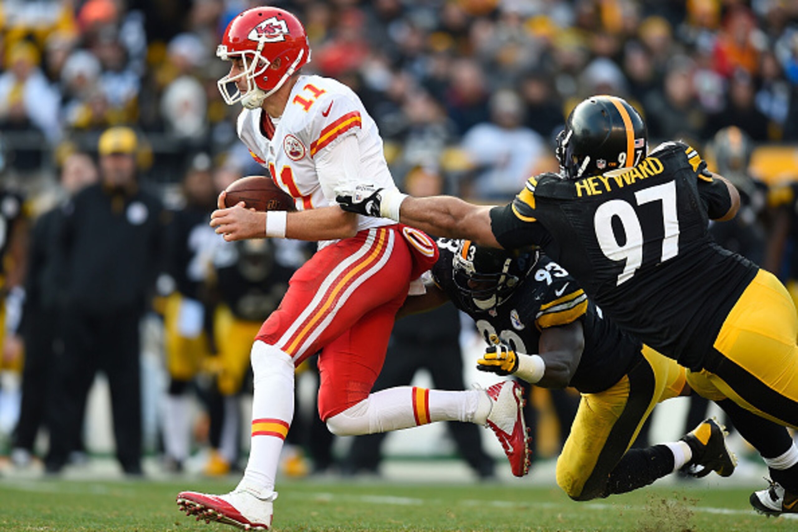 PITTSBURGH, PA - DECEMBER 21:  Alex Smith #11 of the Kansas City Chiefs tries to avoid a tackle by Jason Worilds #93 and Cameron Heyward #97 of the Pittsburgh Steelers during the third quarter at Heinz Field on December 21, 2014 in Pittsburgh, Pennsylvani