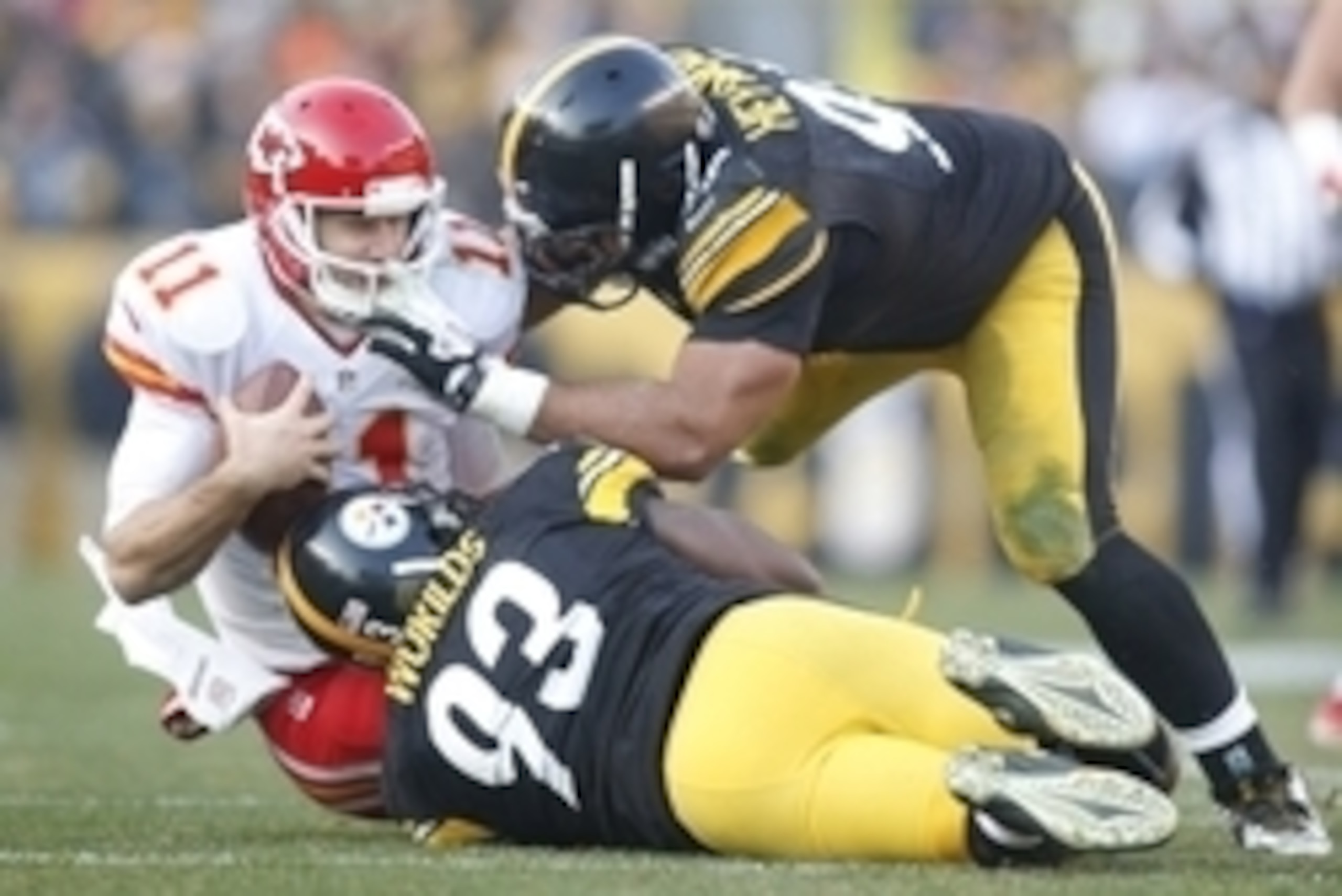 Dec 21, 2014; Pittsburgh, PA, USA; Kansas City Chiefs quarterback Alex Smith (11) is sacked by Pittsburgh Steelers outside linebacker Jason Worilds (93) and defensive end Cameron Heyward (97) during the fourth quarter at Heinz Field. The Steelers won 20-1