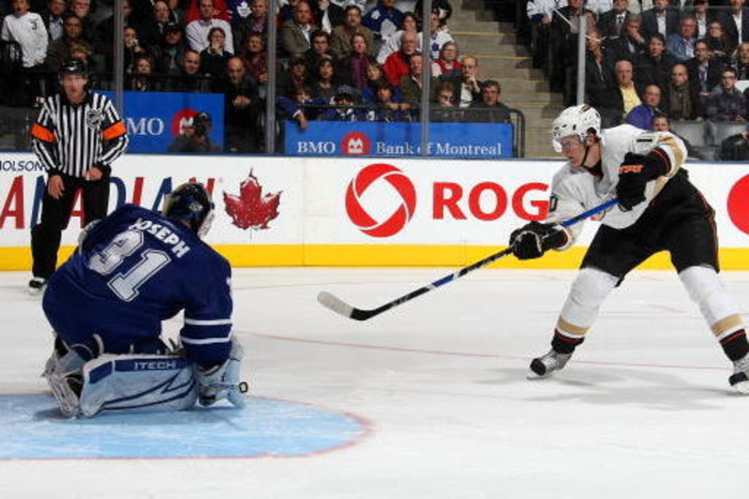 TORONTO - OCTOBER 21:  Corey Perry #10 of the Anaheim Ducks beats Curtis Joseph #31 of the Toronto Maple Leafs on this shot for the winning goal in the shootout during their NHL game at the Air Canada Centre October 21, 2008 in Toronto, Ontario.(Photo By 