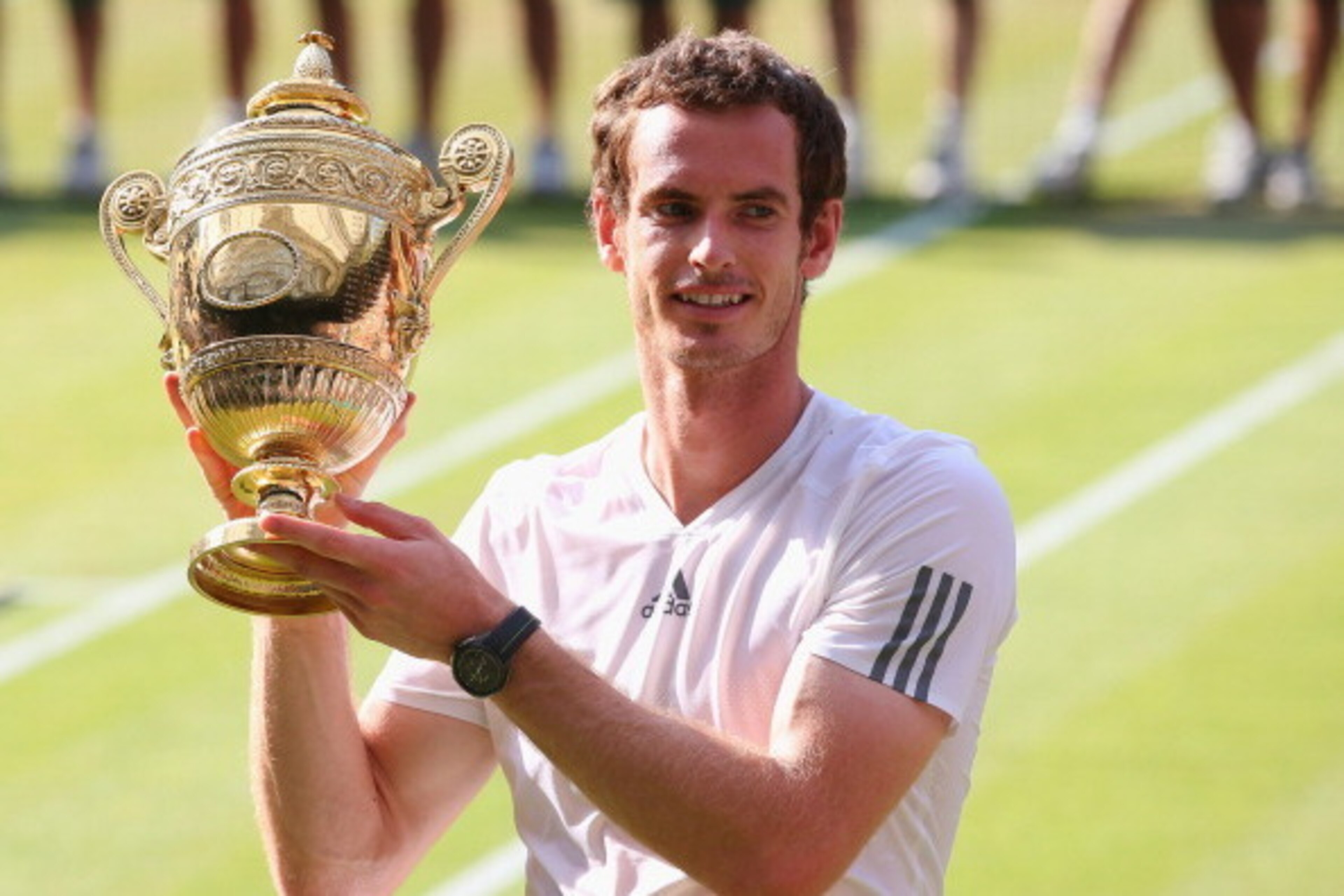 LONDON, ENGLAND - JULY 07: Andy Murray of Great Britain poses with the Gentlemen's Singles Trophy following his victory in the Gentlemen's Singles Final match against Novak Djokovic of Serbia on day thirteen of the Wimbledon Lawn Tennis Championships at LONDON, ENGLAND - JULY 07: Andy Murray of Great Britain poses with the Gentlemen's Singles Trophy following his victory in the Gentlemen's Singles Final match against Novak Djokovic of Serbia on day thirteen of the Wimbledon Lawn Tennis Championships at