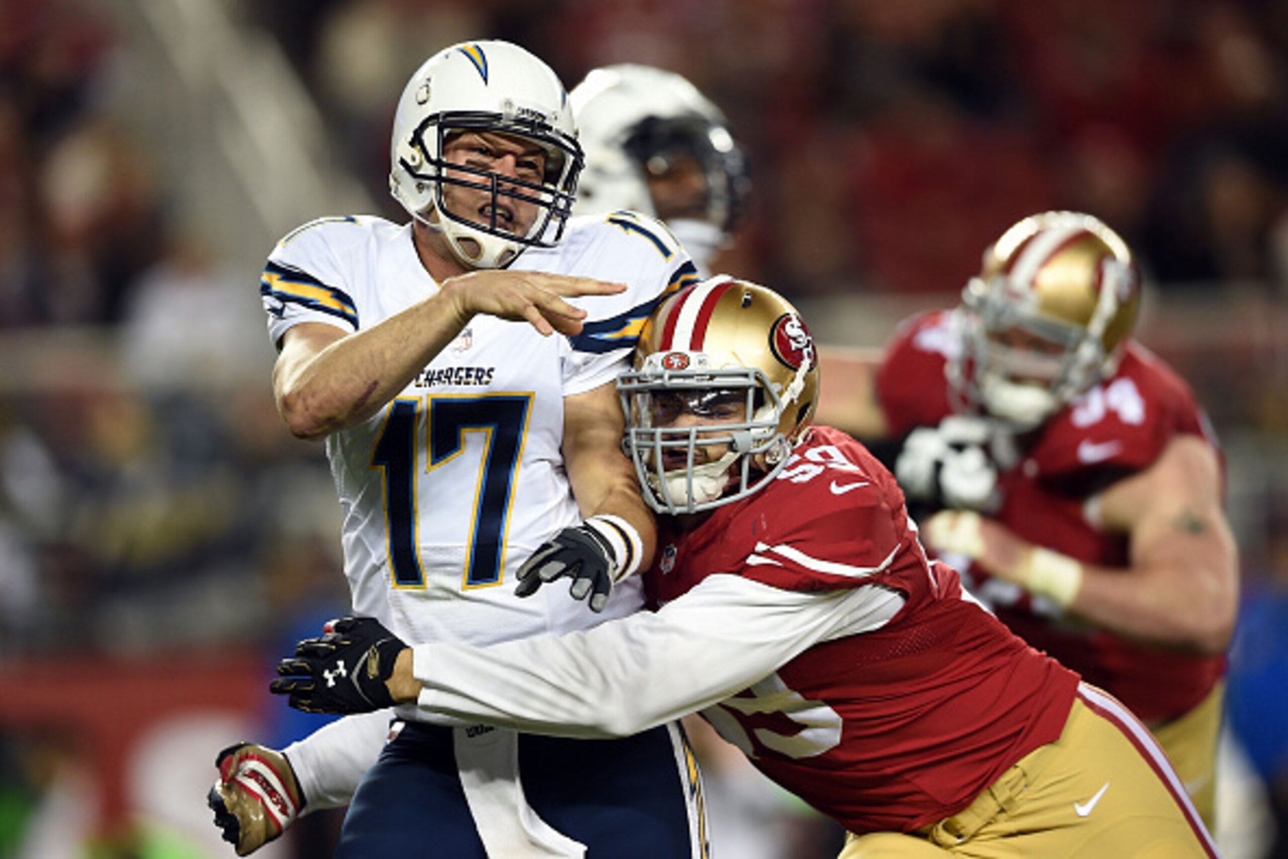 SANTA CLARA, CA - DECEMBER 20:  Philip Rivers #17 of the San Diego Chargers releases under pressure from Aaron Lynch #59 of the San Francisco 49ers in the third quarter at Levi's Stadium on December 20, 2014 in Santa Clara, California.  (Photo by Thearon 