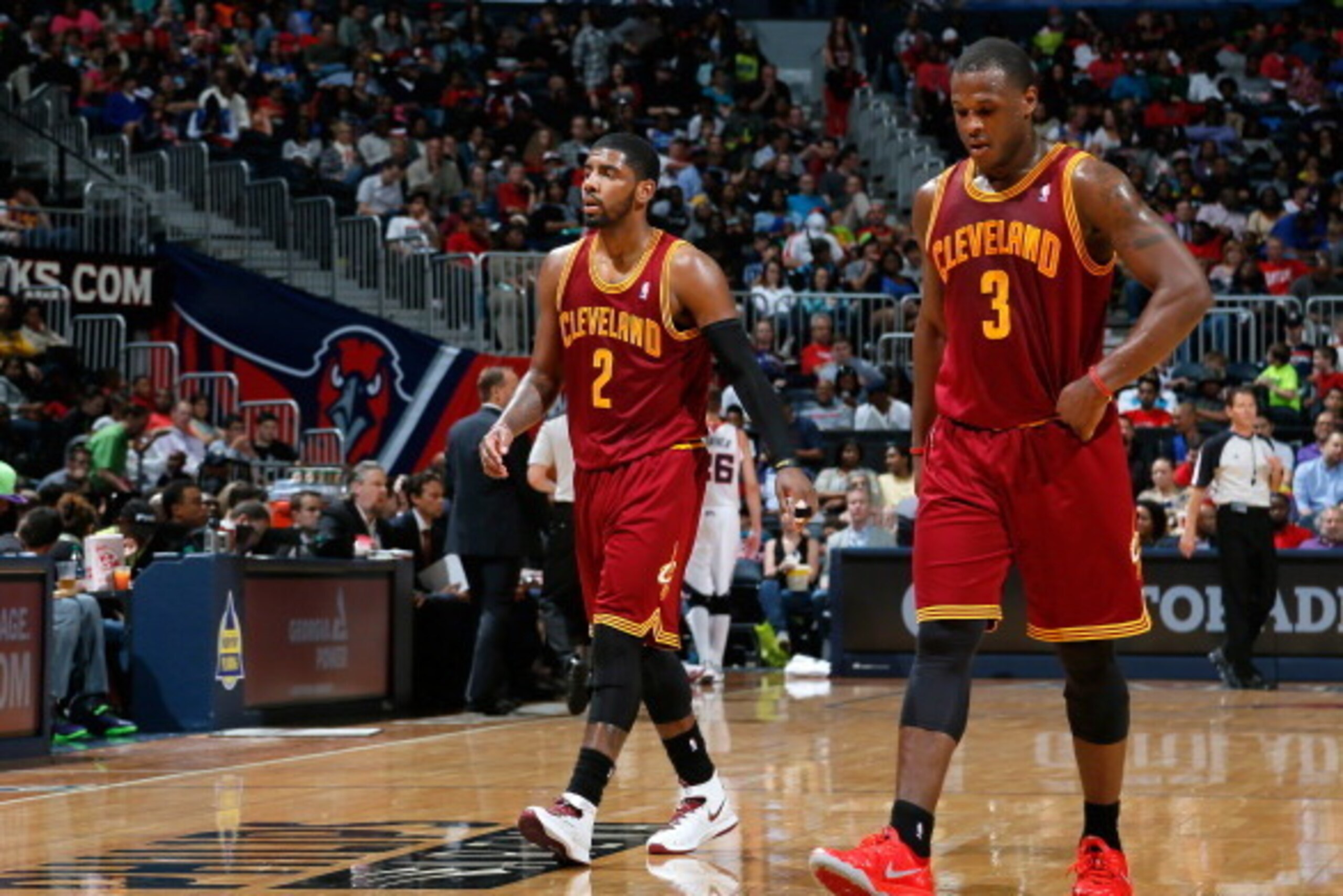ATLANTA, GA - APRIL 04:  Kyrie Irving #2 and Dion Waiters #3 of the Cleveland Cavaliers walk off the court between free throws in their 117-98 loss to the Atlanta Hawks at Philips Arena on April 4, 2014 in Atlanta, Georgia.  NOTE TO USER: User expressly a
