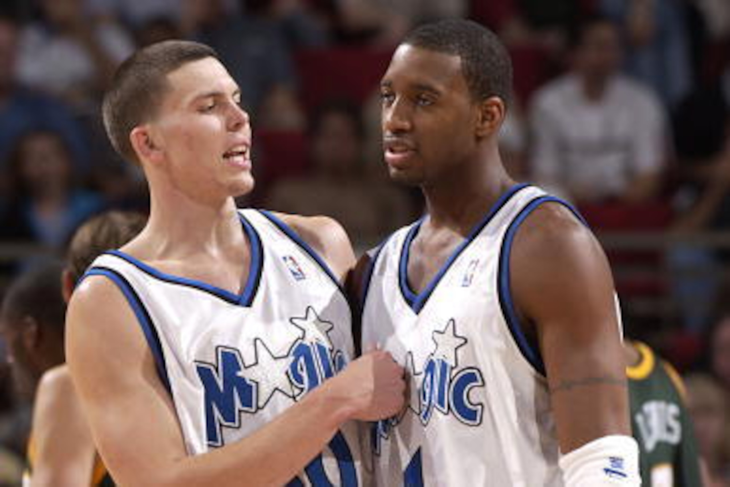 ORLANDO - NOVEMBER 8: Tracy McGrady #1 and Mike Miller #50 of the Orlando Magic celebrate against the Seattle SuperSonics at the TD Waterhouse Centre on November 8, 2002 in Orlando, Florida. Note to User: User expressly acknowledges and agrees that, ORLANDO - NOVEMBER 8: Tracy McGrady #1 and Mike Miller #50 of the Orlando Magic celebrate against the Seattle SuperSonics at the TD Waterhouse Centre on November 8, 2002 in Orlando, Florida. Note to User: User expressly acknowledges and agrees that,