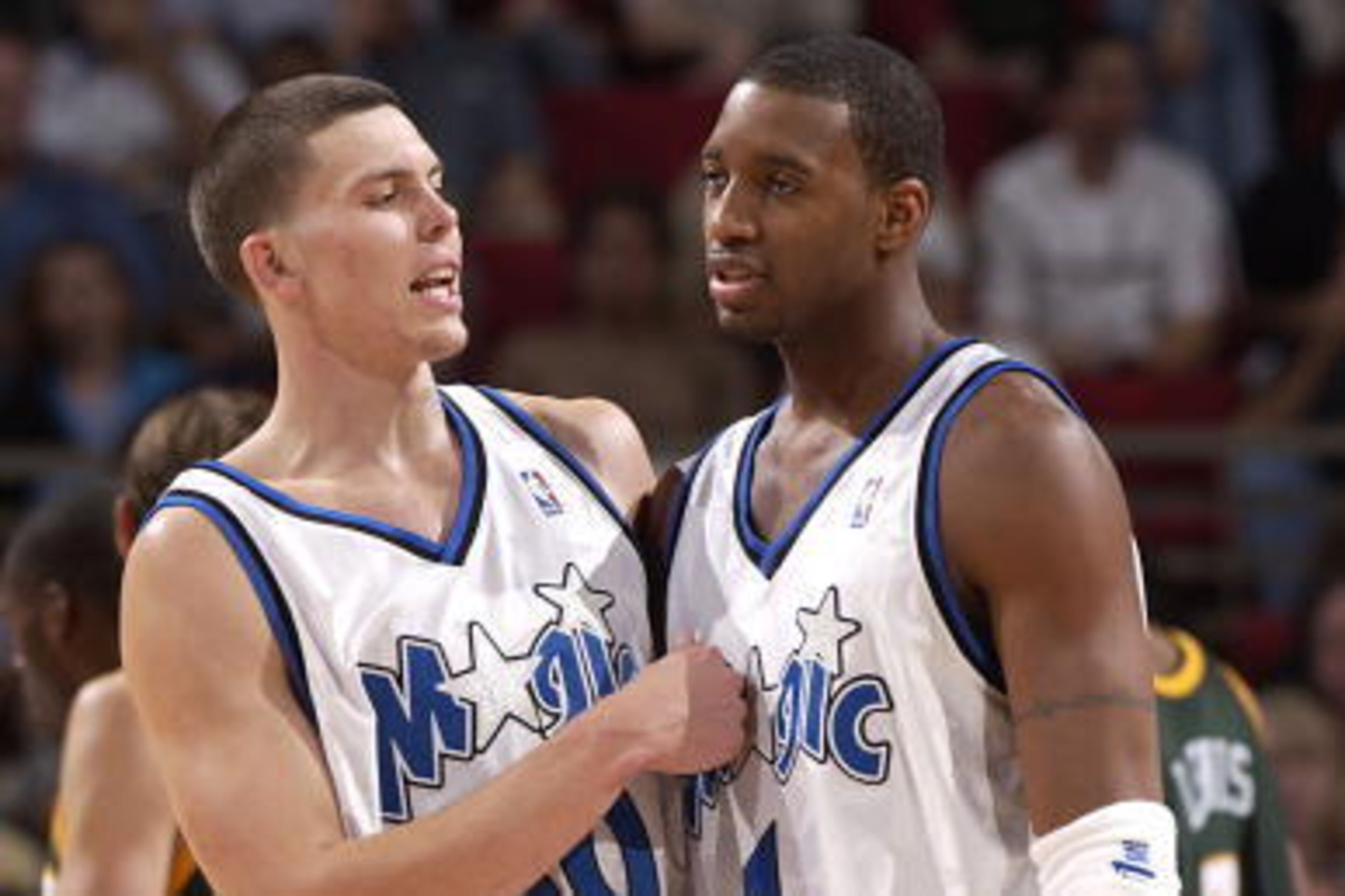ORLANDO - NOVEMBER 8:  Tracy McGrady #1 and Mike Miller #50 of the Orlando Magic celebrate against the Seattle SuperSonics at the TD Waterhouse Centre on November 8, 2002 in Orlando, Florida.   Note to User:   User expressly acknowledges and agrees that, 