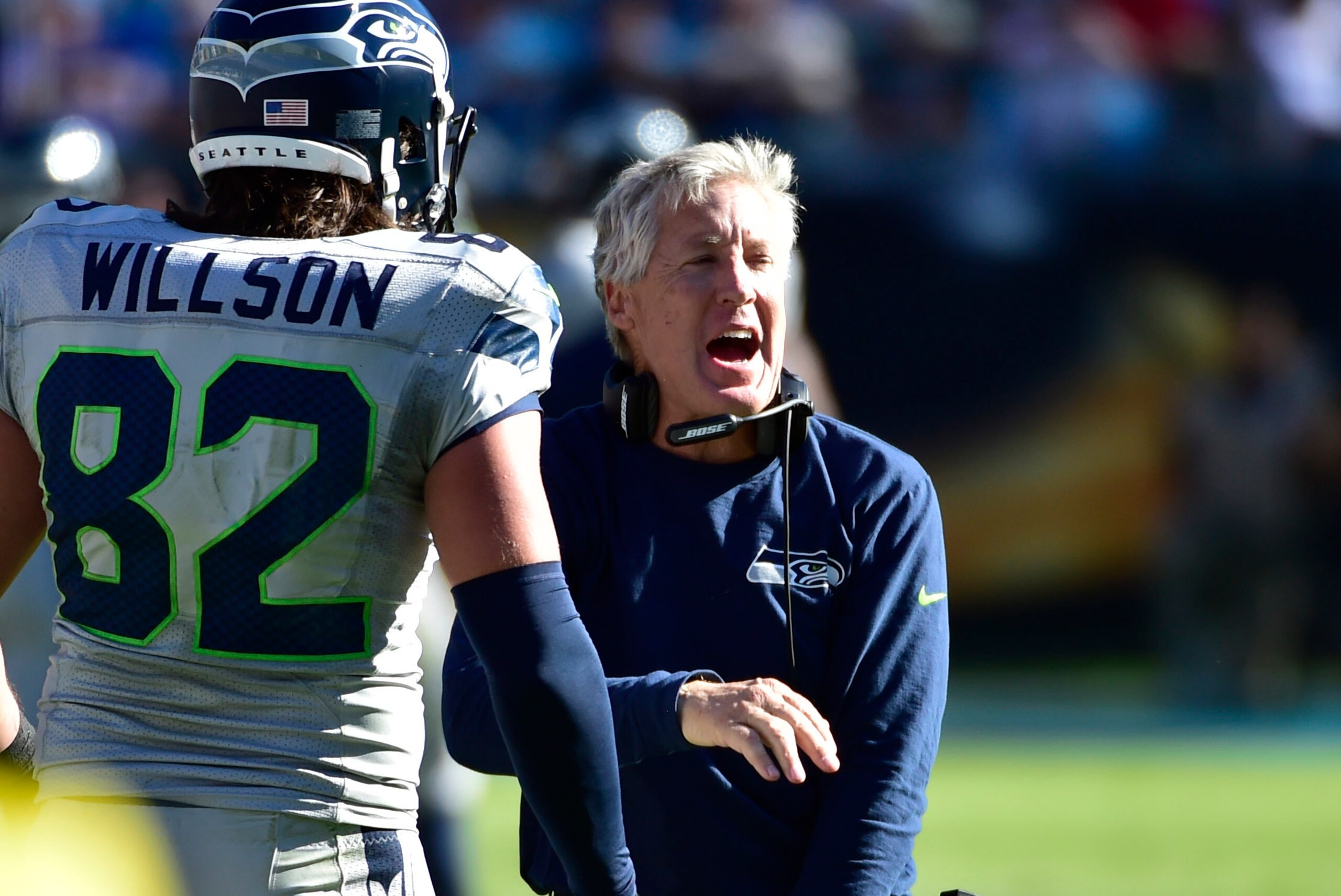 Oct 26, 2014; Charlotte, NC, USA; Seattle Seahawks head coach Pete Carroll reacts with tight end Luke Willson (82) after Wilson scored a touchdown in the fourth quarter. The Seahawks defeated the Panthers 13-9 at Bank of America Stadium. Mandatory Credit:
