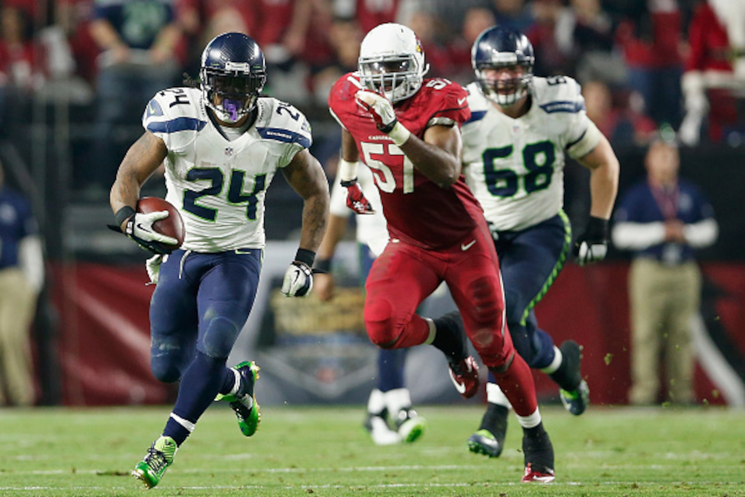 GLENDALE, AZ - DECEMBER 21: Running back Marshawn Lynch #24 of the Seattle Seahawks runs with the football to score 79 yard touchdown in the fourth quarter during the NFL game at the University of Phoenix Stadium on December 21, 2014 in Glendale, Arizona GLENDALE, AZ - DECEMBER 21: Running back Marshawn Lynch #24 of the Seattle Seahawks runs with the football to score 79 yard touchdown in the fourth quarter during the NFL game at the University of Phoenix Stadium on December 21, 2014 in Glendale, Arizona