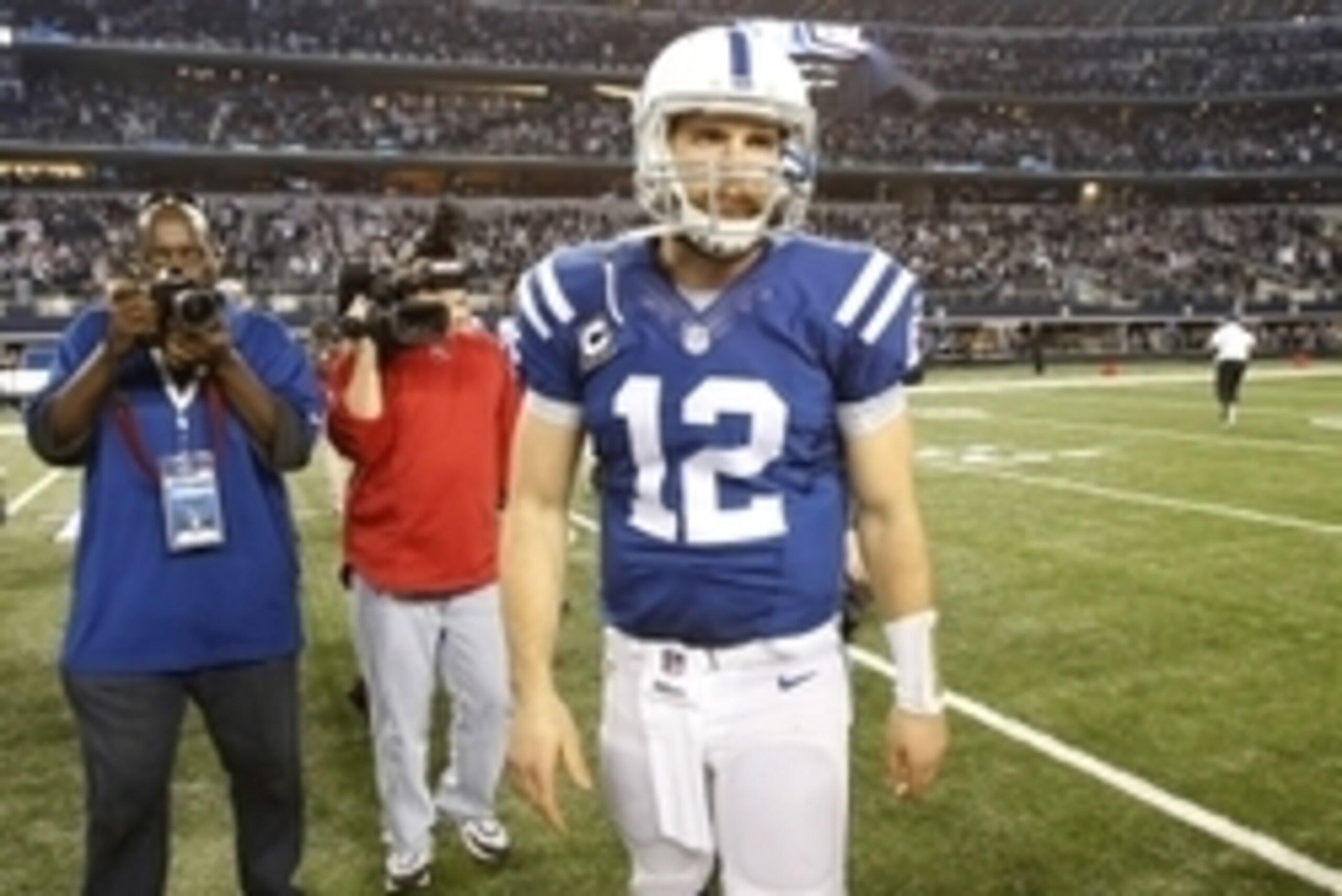 Dec 21, 2014; Arlington, TX, USA;  Indianapolis Colts quarterback Andrew Luck (12) leaves the field after the game against the Dallas Cowboys at AT&T Stadium. Dallas beat Indianapolis 42-7. Mandatory Credit: Tim Heitman-USA TODAY Sports