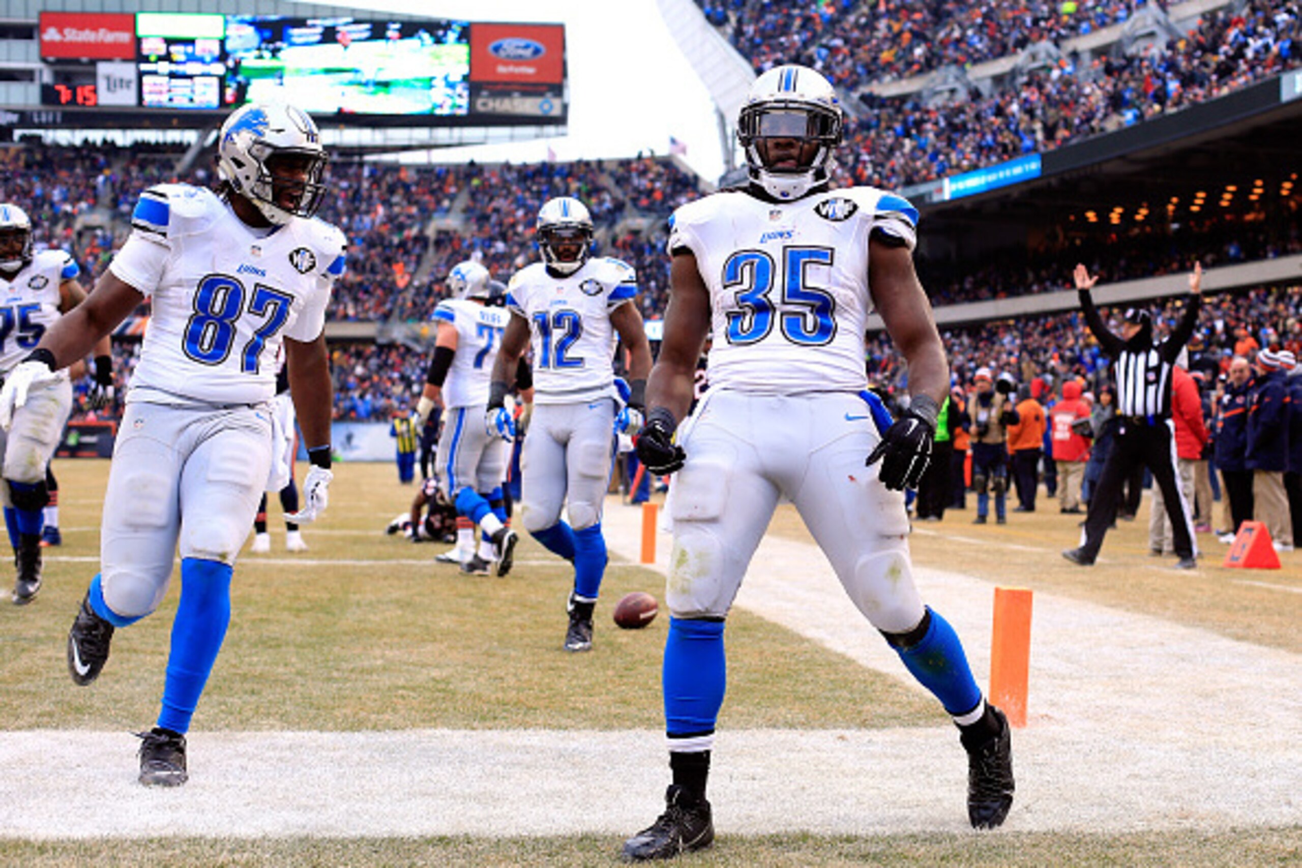 CHICAGO, IL - DECEMBER 21:  Joique Bell #35 of the Detroit Lions reacts after scoring a touchdown during the second half of the game against the Chicago Bears at Soldier Field on December 21, 2014 in Chicago, Illinois.  (Photo by Jamie Squire/Getty Images