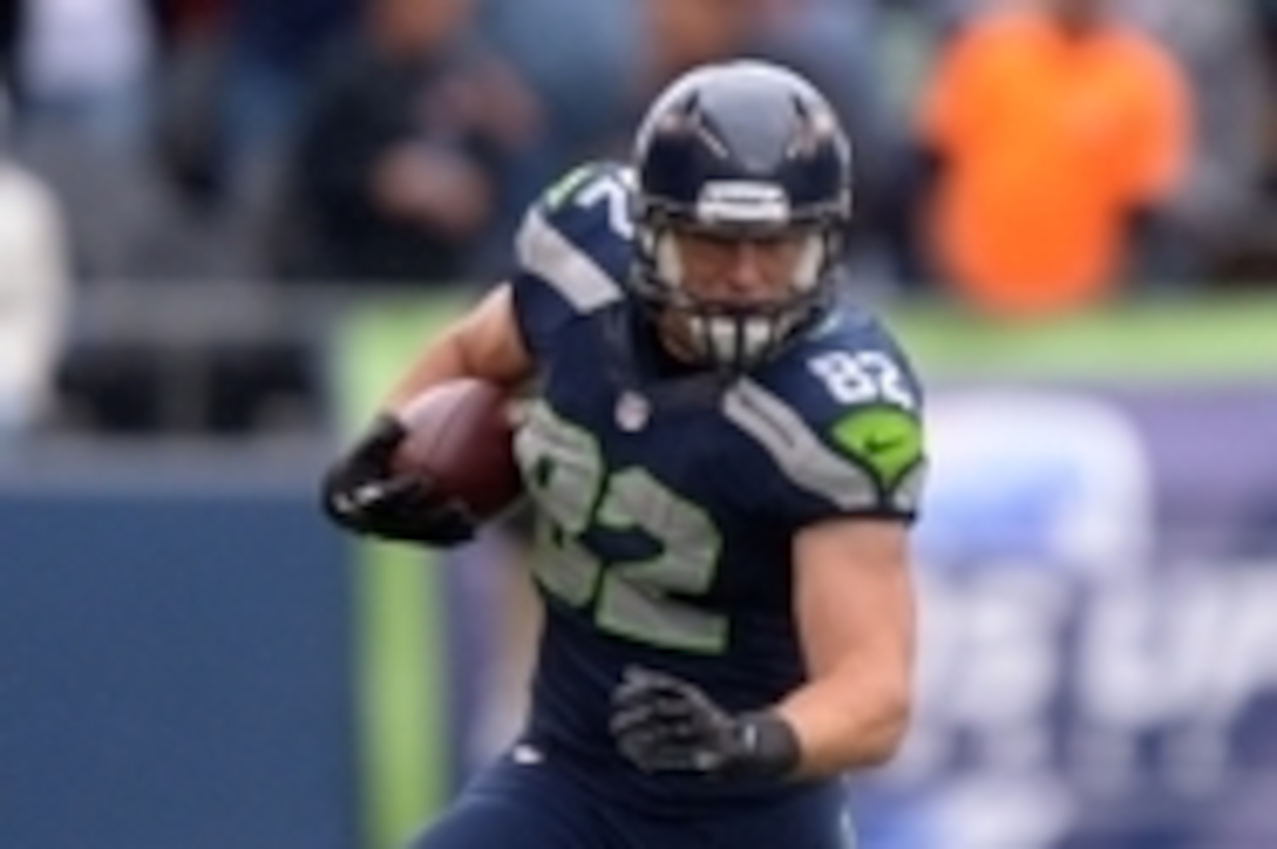 Sep 22, 2013; Seattle, WA, USA; Seattle Seahawks tight end Luke Wilson (82) carries the ball against the Jacksonville Jaguars at CenturyLink Field. The Seahawks defeated the Jaguars 45-17. Mandatory Credit: Kirby Lee-USA TODAY Sports