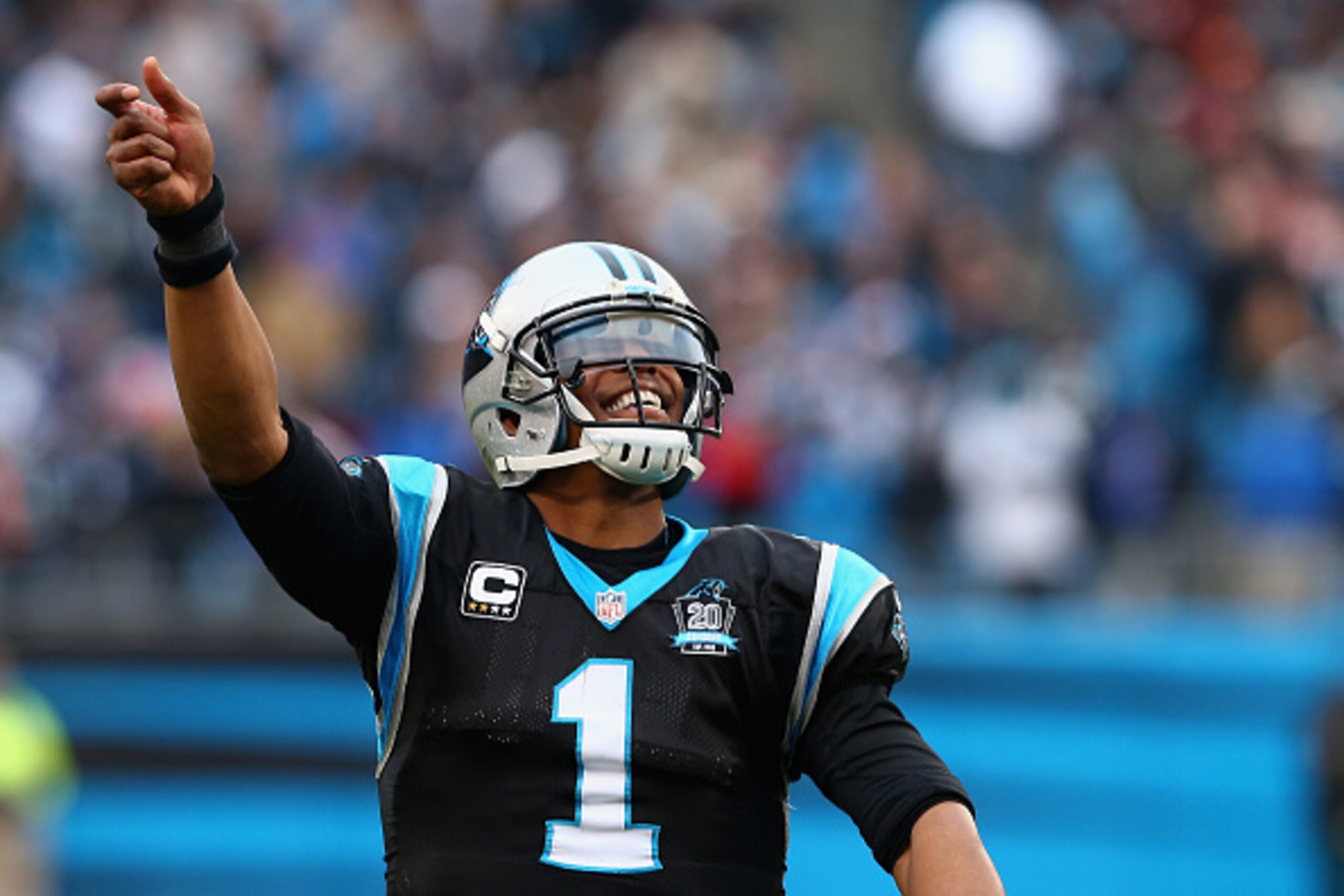 CHARLOTTE, NC - DECEMBER 21:  Cam Newton #1 of the Carolina Panthers begins celebrating victory against the Cleveland Browns with time still on the clock, gesturing for the crowd to 'turn up' at Bank of America Stadium on December 21, 2014 in Charlotte, N