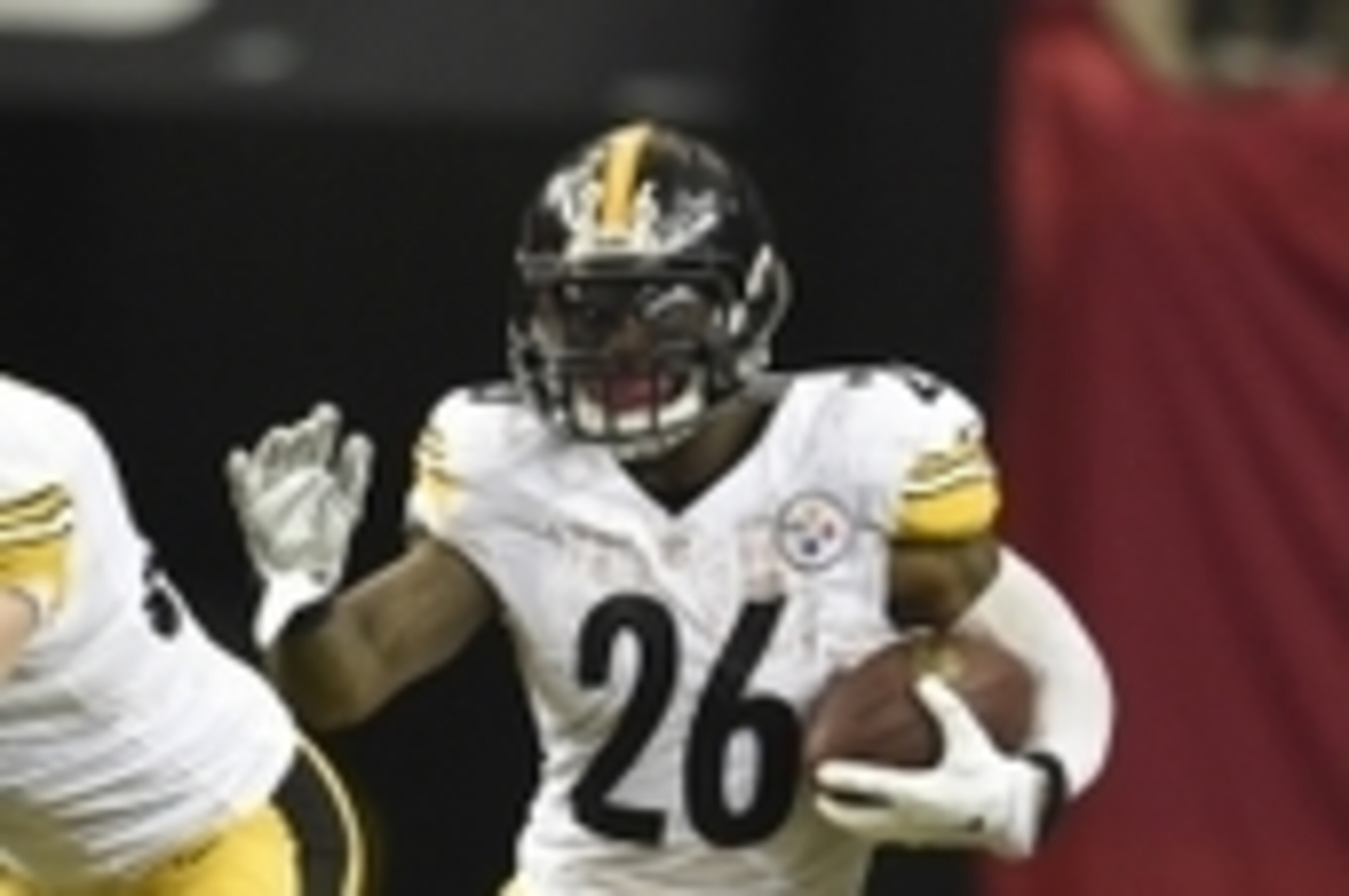Dec 14, 2014; Atlanta, GA, USA; Pittsburgh Steelers running back Le'Veon Bell (26) carries the ball against the Atlanta Falcons at the Georgia Dome. Mandatory Credit: RVR Photos-USA TODAY Sports