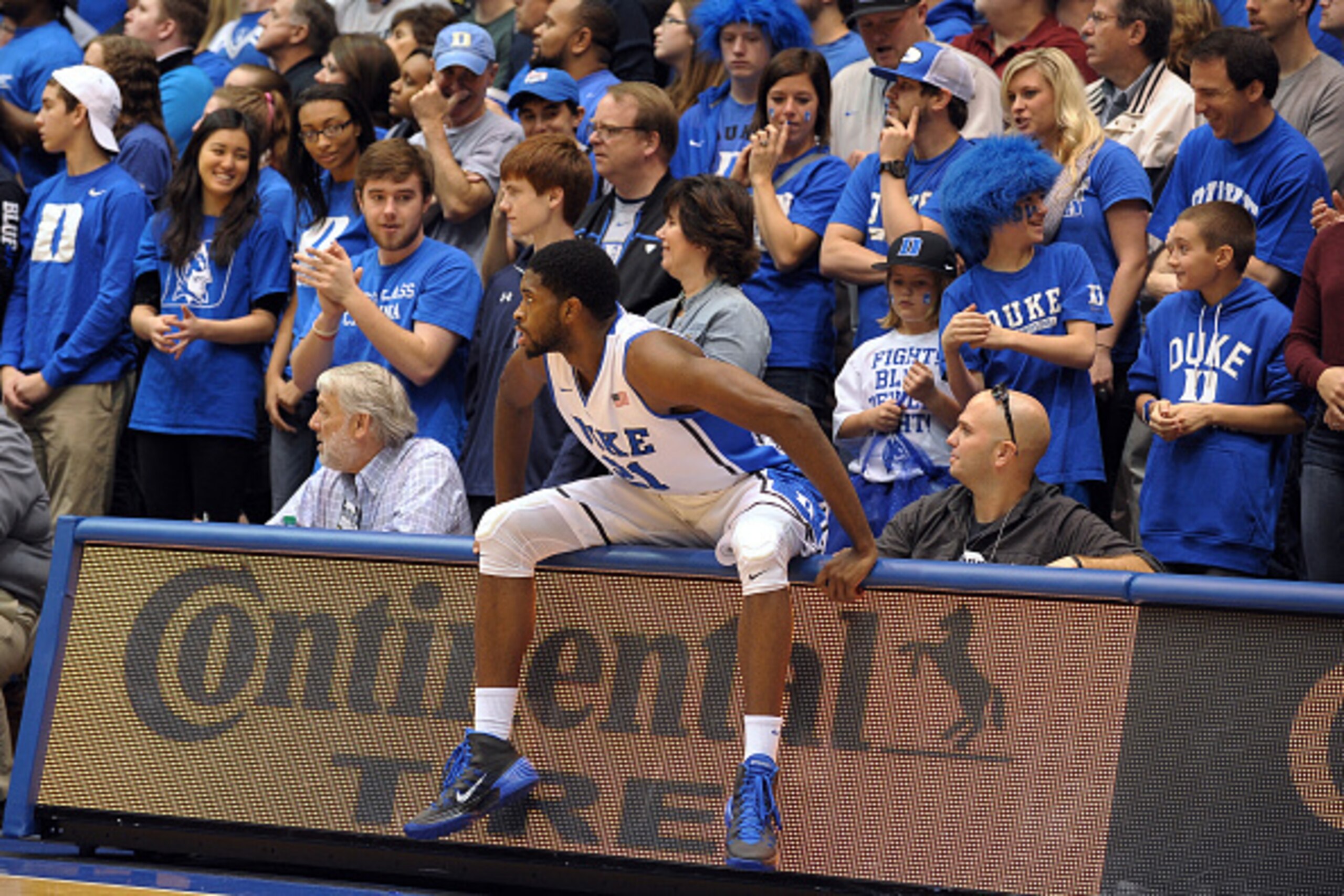 DURHAM, NC - NOVEMBER 30: Amile Jefferson #21 of the Duke Blue Devils looks on after falling into press row during a game against the Army Black Knights at Cameron Indoor Stadium on November 30, 2014 in Durham, North Carolina. (Photo by Lance King/Getty I