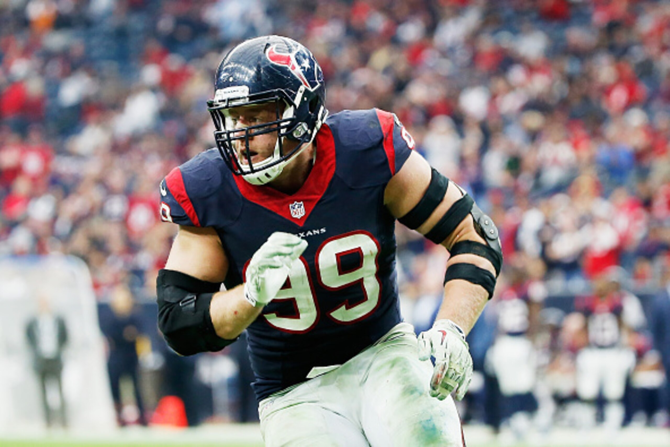 HOUSTON, TX - DECEMBER 21: J.J. Watt #99 of the Houston Texans rushes the passer during their game against the Baltimore Ravens at NRG Stadium on December 21, 2014 in Houston, Texas. (Photo by Scott Halleran/Getty Images) HOUSTON, TX - DECEMBER 21: J.J. Watt #99 of the Houston Texans rushes the passer during their game against the Baltimore Ravens at NRG Stadium on December 21, 2014 in Houston, Texas. (Photo by Scott Halleran/Getty Images)