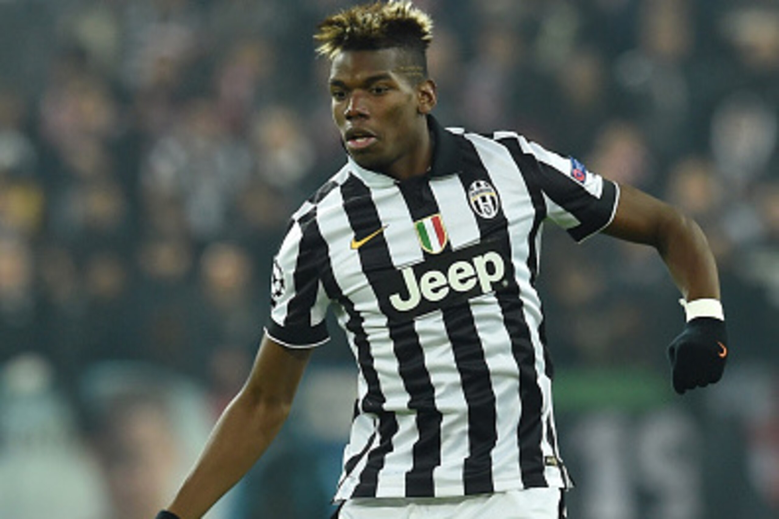 TURIN, ITALY - DECEMBER 09: Paul Pogba of Juventus in action during the UEFA Champions League group A match between Juventus and Club Atletico de Madrid at Juventus Arena on December 9, 2014 in Turin, Italy. (Photo by Valerio Pennicino/Getty Images) TURIN, ITALY - DECEMBER 09: Paul Pogba of Juventus in action during the UEFA Champions League group A match between Juventus and Club Atletico de Madrid at Juventus Arena on December 9, 2014 in Turin, Italy. (Photo by Valerio Pennicino/Getty Images)
