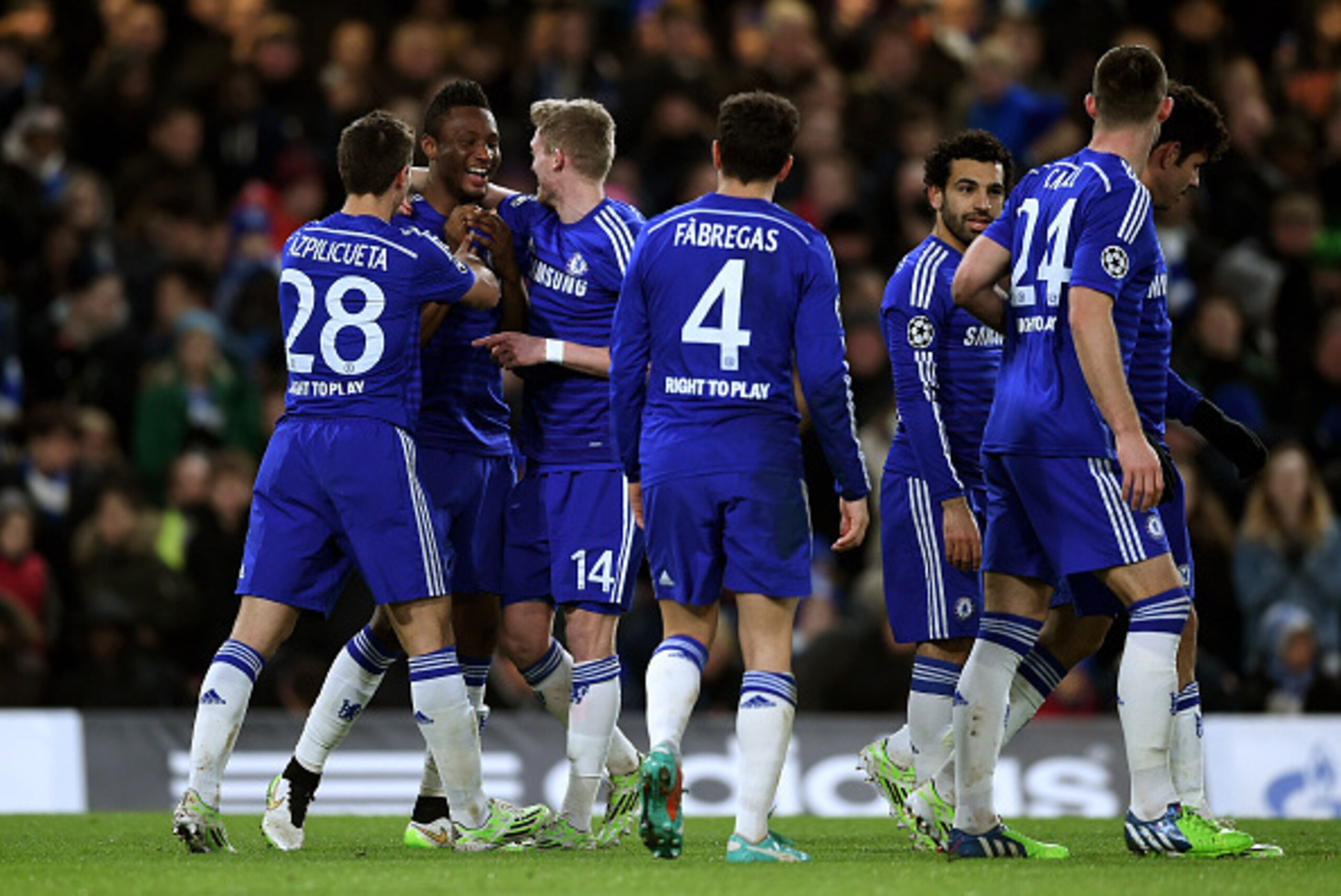 LONDON, ENGLAND - DECEMBER 10:  Mikel John Obi #12 of Chelsea is congratulated by teammates after scoring his team's third goal during the UEFA Champions League group G match between Chelsea and Sporting Clube de Portugal at Stamford Bridge on December 10