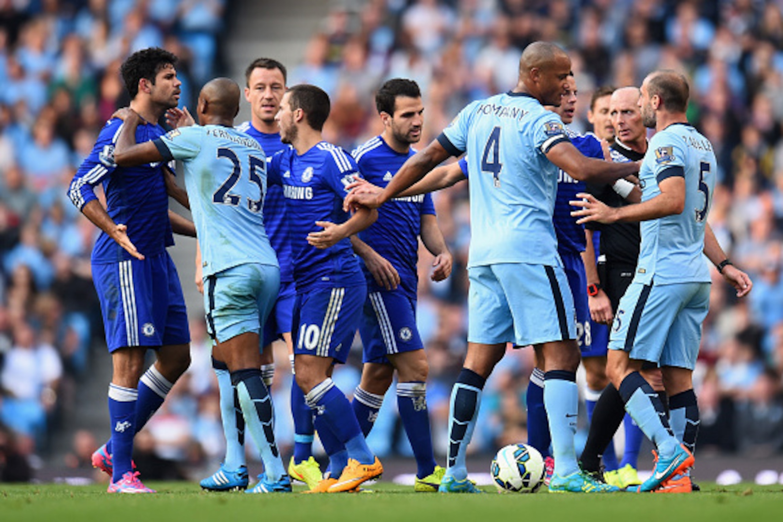 MANCHESTER, ENGLAND - SEPTEMBER 21:   Pablo Zabaleta of Manchester City is separated from Diego Costa of Chelsea by his team-mates during the Barclays Premier League match between Manchester City and Chelsea at the Etihad Stadium on September 21, 2014 in 