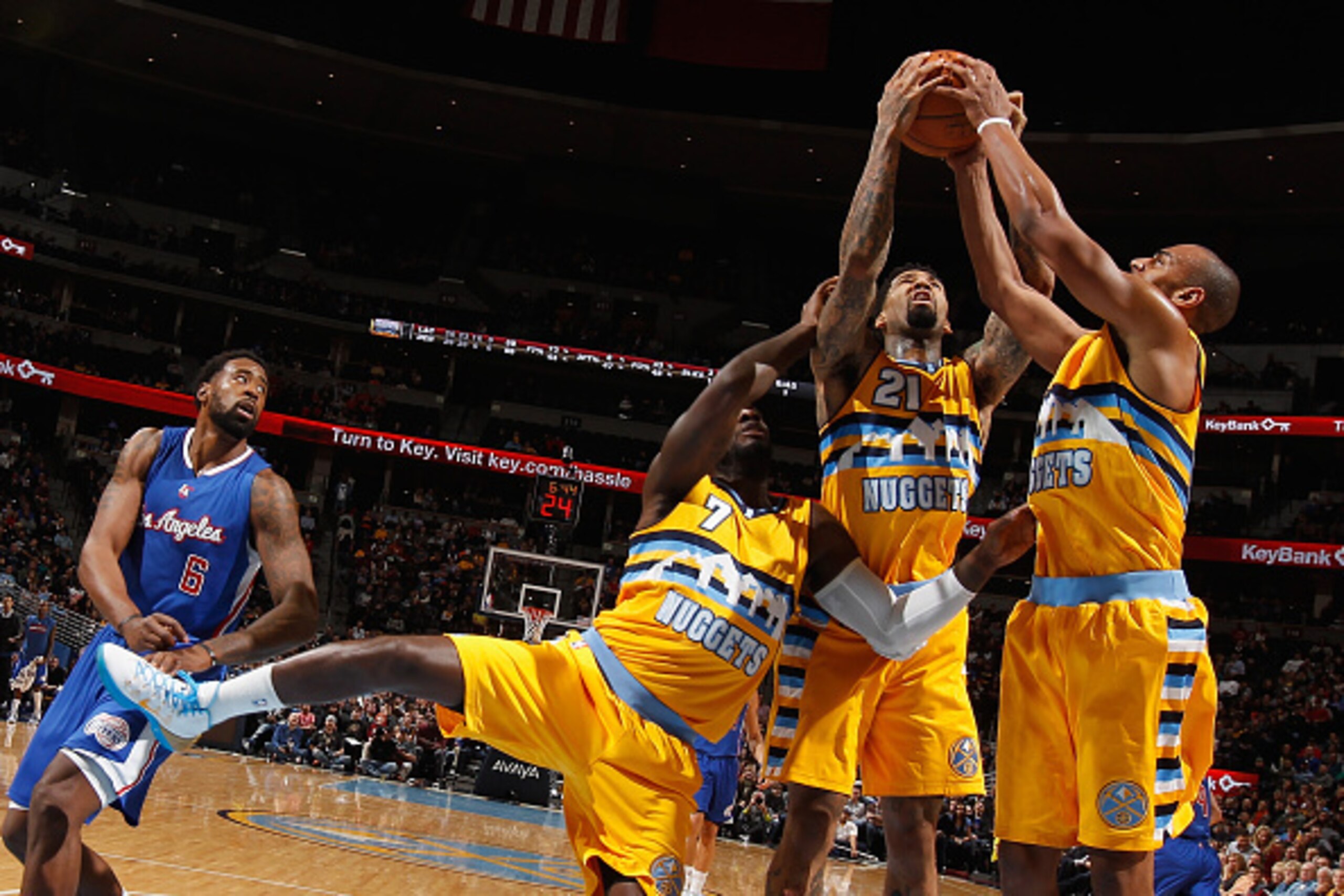 DENVER, CO - DECEMBER 19:  J.J. Hickson #7, Wilson Chandler #21 and Arron Afflalo #10 of the Denver Nuggets collect a rebound from DeAndre Jordan #6 of the Los Angeles Clippers at Pepsi Center on December 19, 2014 in Denver, Colorado. The Nuggets defeated