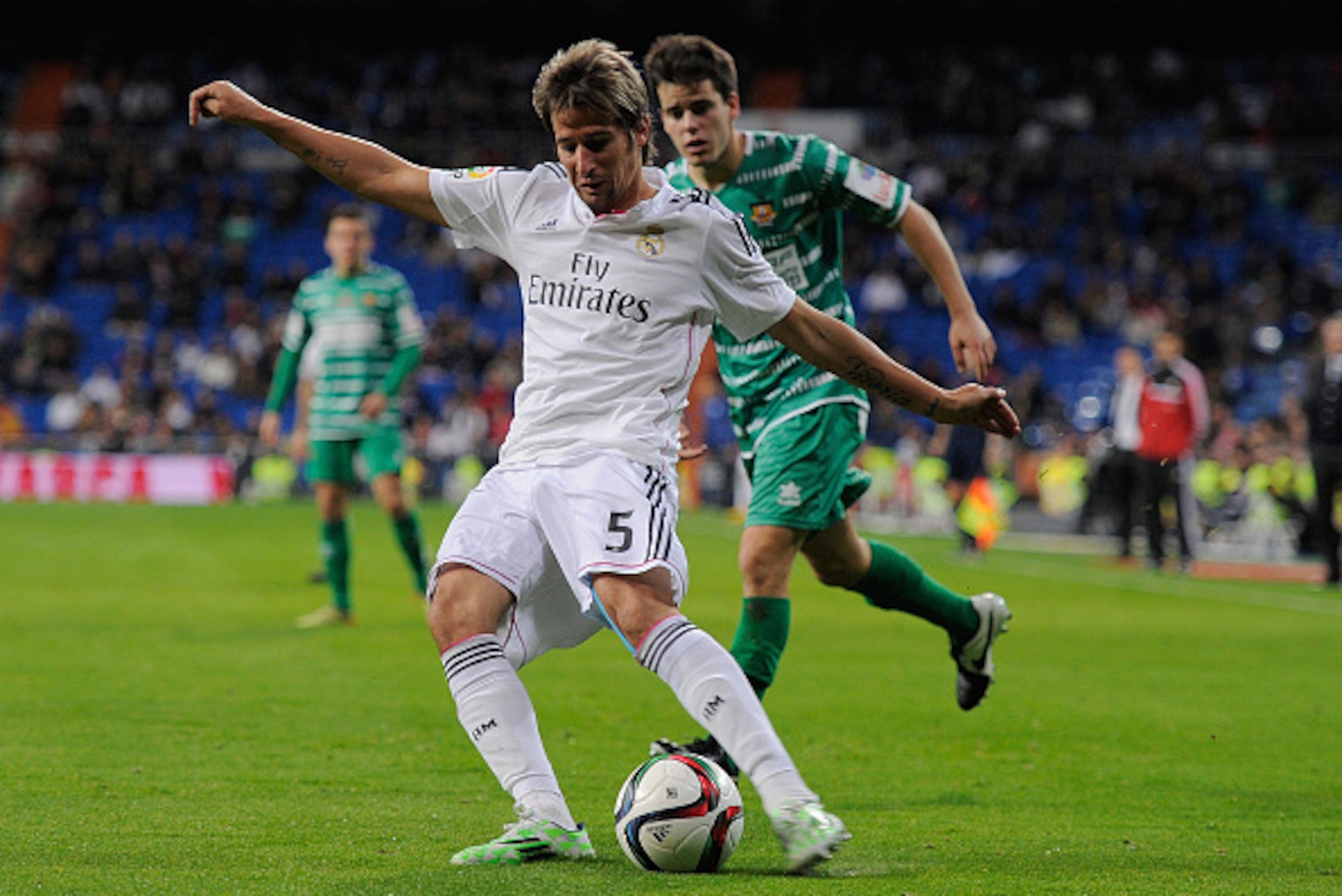 MADRID, SPAIN - DECEMBER 02:  Fabio Coentrao of Real Madrid crosses the ball during the Copa Del Rey Round of 32, Second Leg match between Real Madrid CF and Cornella at Santiago Bernabeu stadium on December 2, 2014 in Madrid, Spain.  (Photo by Denis Doyl
