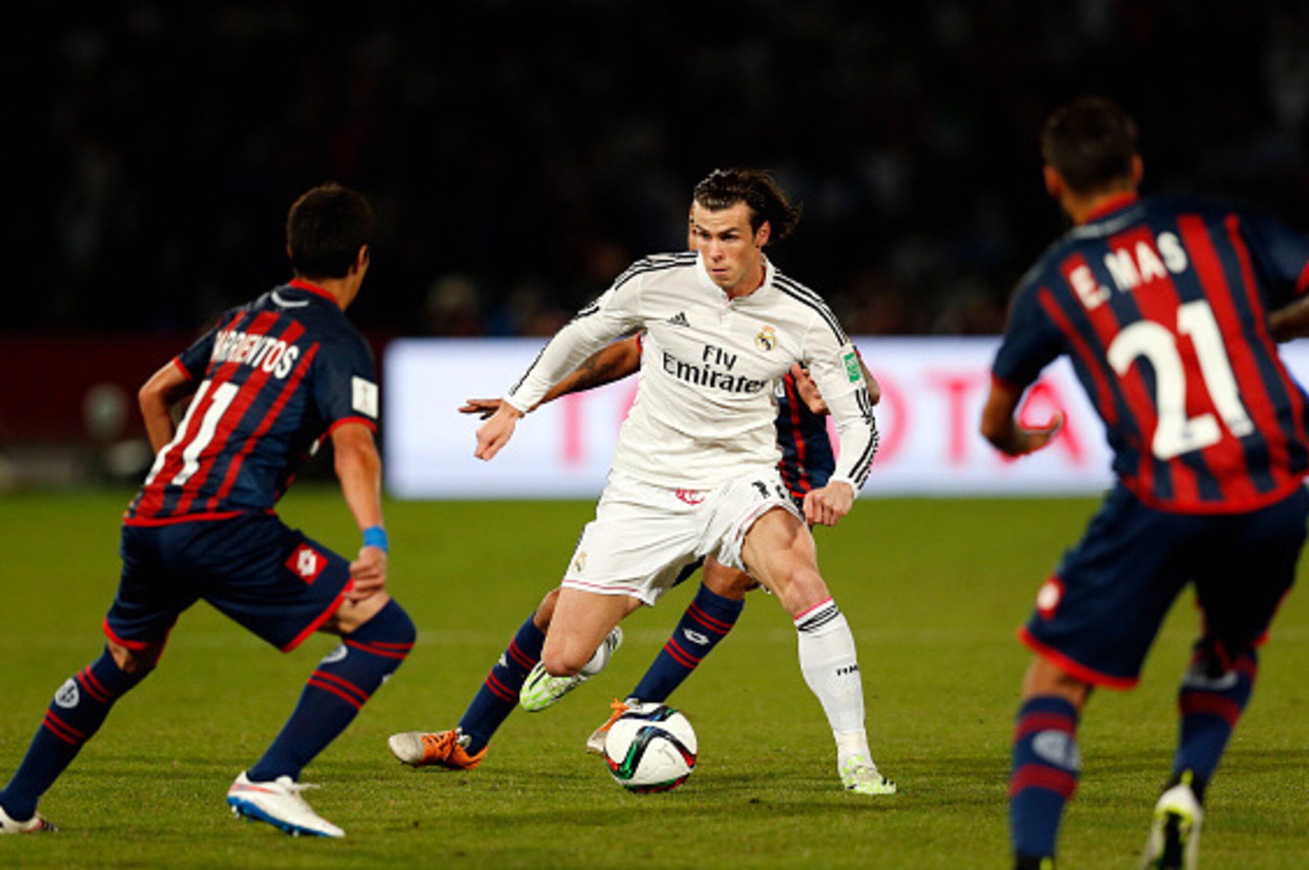 MARRAKECH, MOROCCO - DECEMBER 20: Gareth Bale of Real Madrid CF takes on the San Lorenzo defence during the FIFA Club World Cup Final match between Real Madrid CF and San Lorenzo at Le Grand Stade de Marrakech on December 20, 2014 in Marrakech, Morocco.  