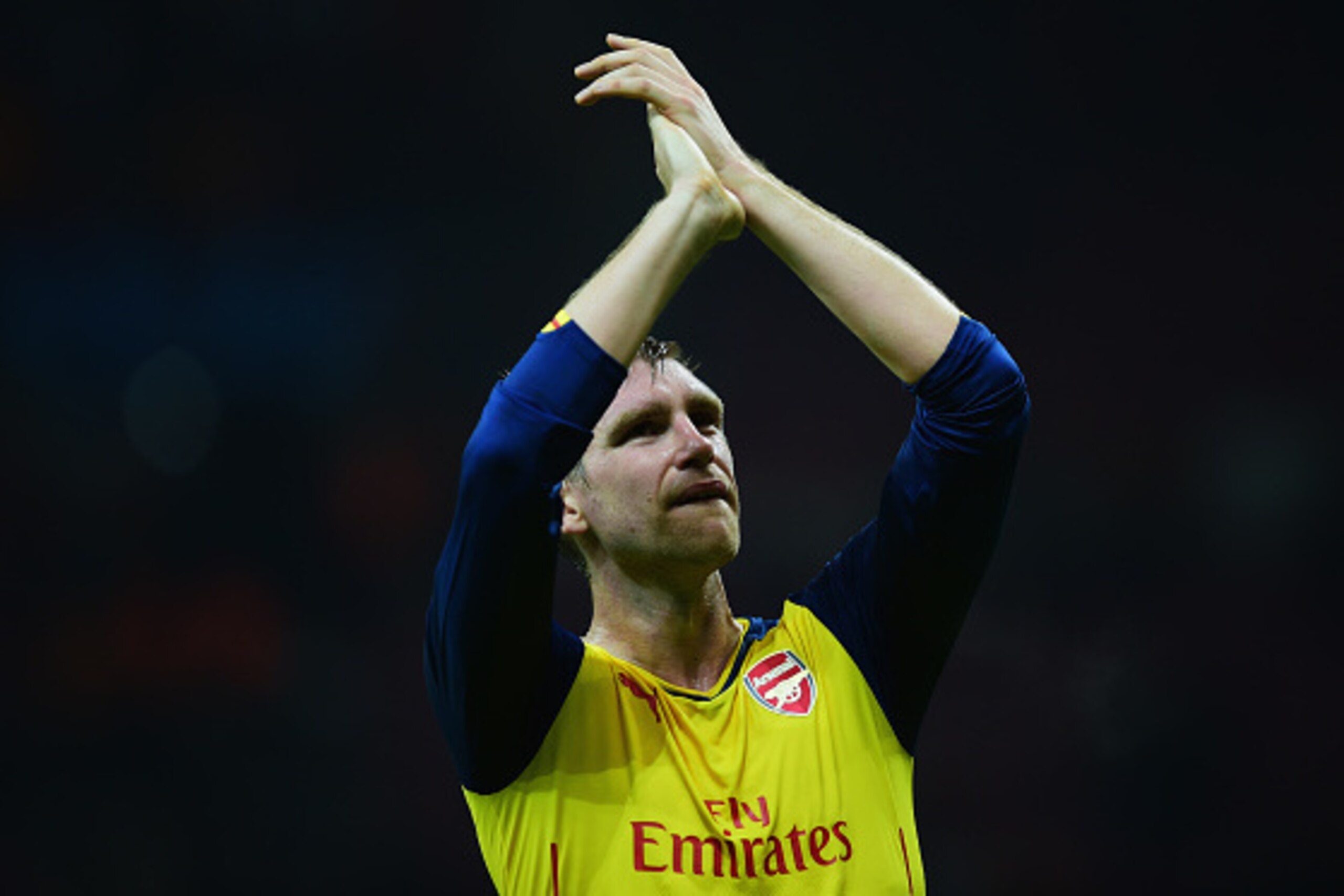 ISTANBUL, TURKEY - DECEMBER 09:  Per Mertesacker of Arsenal applauds the crowd after victory in the UEFA Champions League Group D match between Galatasaray AS and Arsenal FC at Ali Sami Yen Arena on December 9, 2014 in Istanbul, Turkey.  (Photo by Jamie M