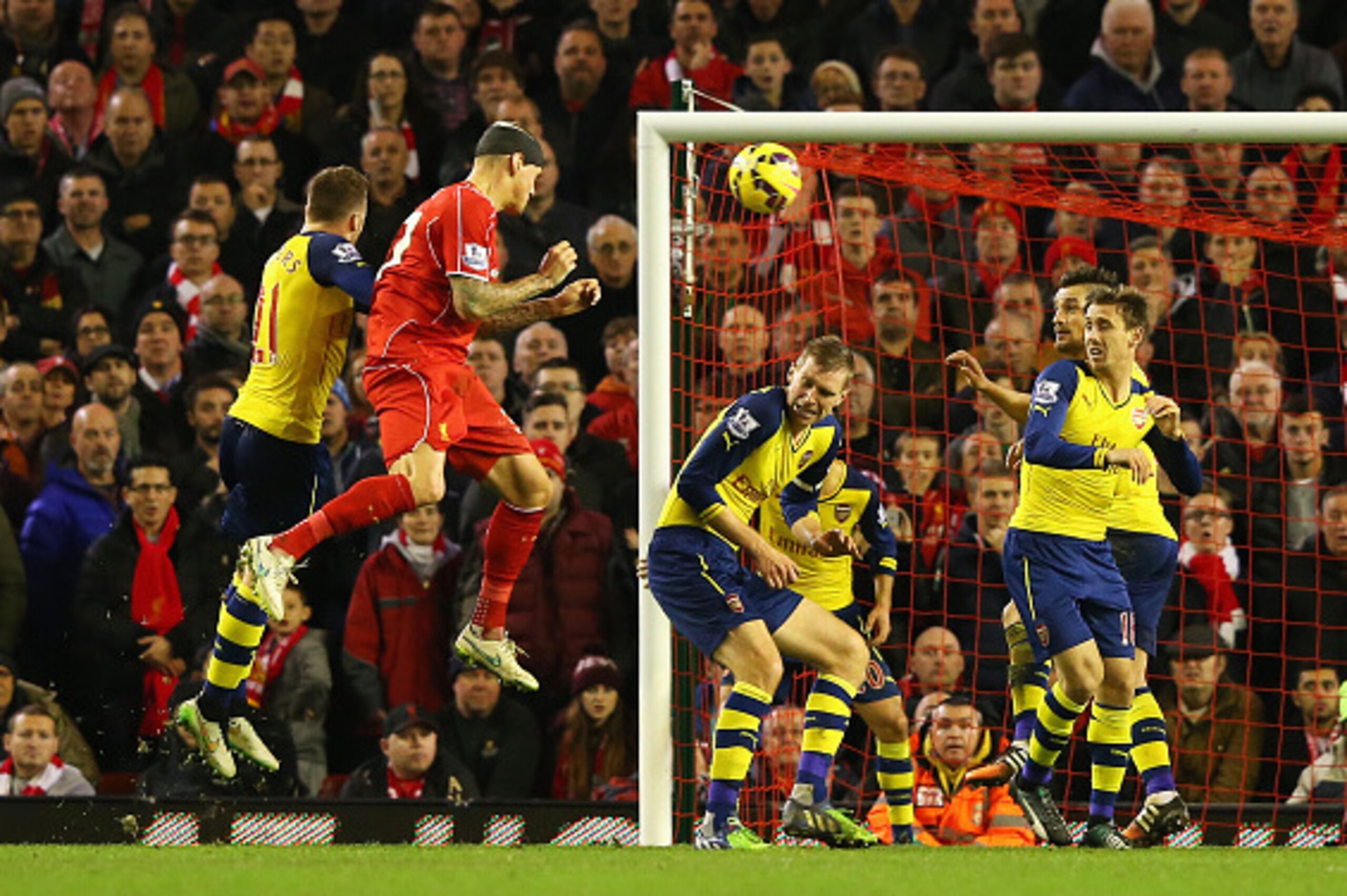 LIVERPOOL, ENGLAND - DECEMBER 21:  Martin Skrtel of Liverpool heads the equalising goal during the Barclays Premier League match between Liverpool and Arsenal at Anfield on December 21, 2014 in Liverpool, England.  (Photo by Alex Livesey/Getty Images)