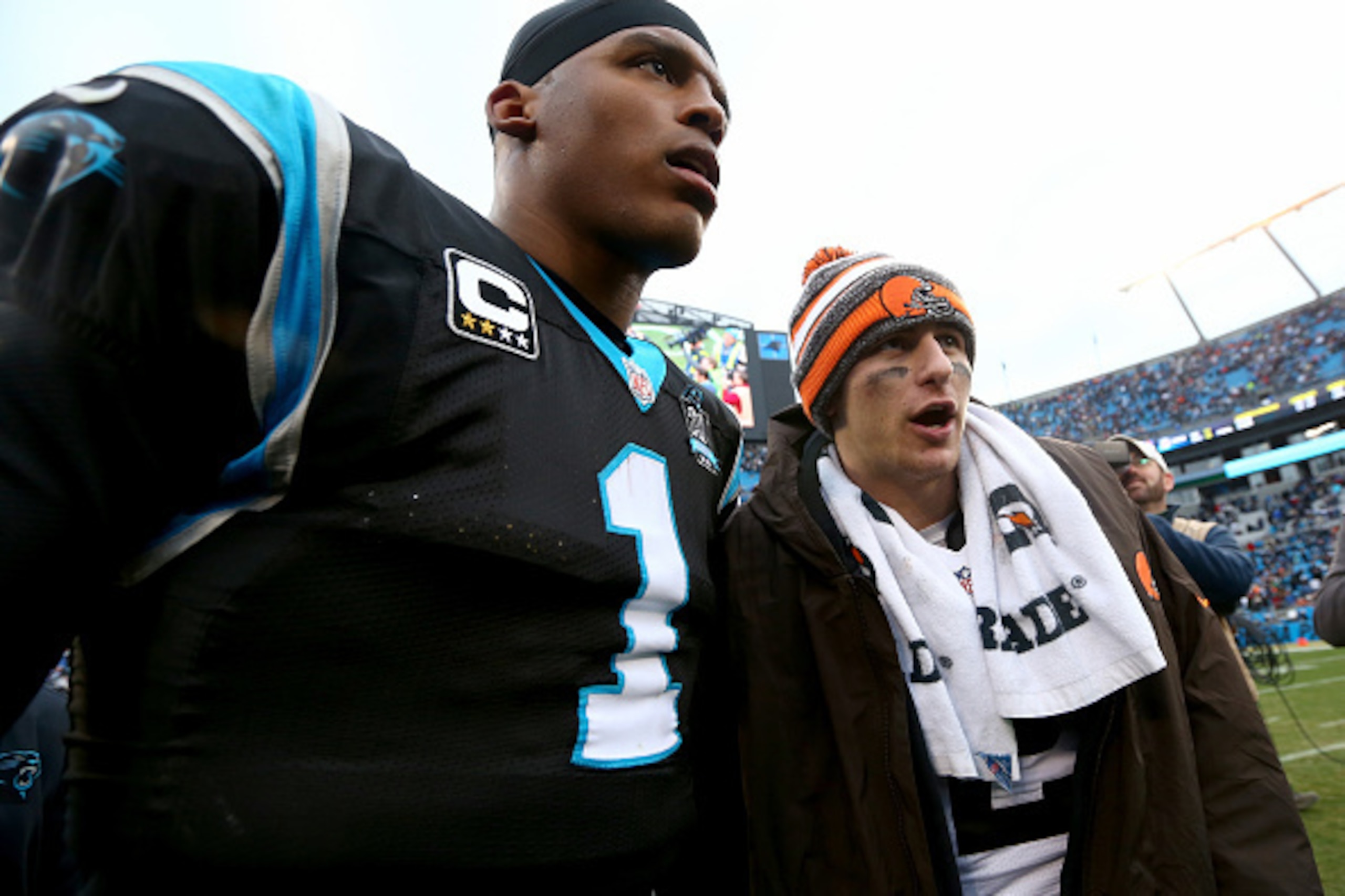CHARLOTTE, NC - DECEMBER 21:  Cam Newton #1 of the Carolina Panthers and Johnny Manziel #2 of the Cleveland Browns exchange words after their game at Bank of America Stadium on December 21, 2014 in Charlotte, North Carolina.  (Photo by Streeter Lecka/Gett