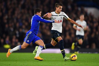 LONDON, ENGLAND - DECEMBER 03:  Eden Hazard of Chelsea challenges Erik Lamela of Spurs during the Barclays Premier League match between Chelsea and Tottenham Hotspur at Stamford Bridge on December 3, 2014 in London, England.  (Photo by Shaun Botterill/Get