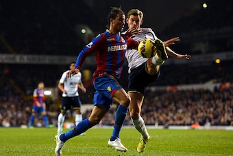 LONDON, ENGLAND - DECEMBER 06:  Jan Vertonghen of Spurs attempts to clear the ball under pressure from Marouane Chamakh of Crystal Palace during the Barclays Premier League match between Tottenham Hotspur and Crystal Palace at White Hart Lane on December 