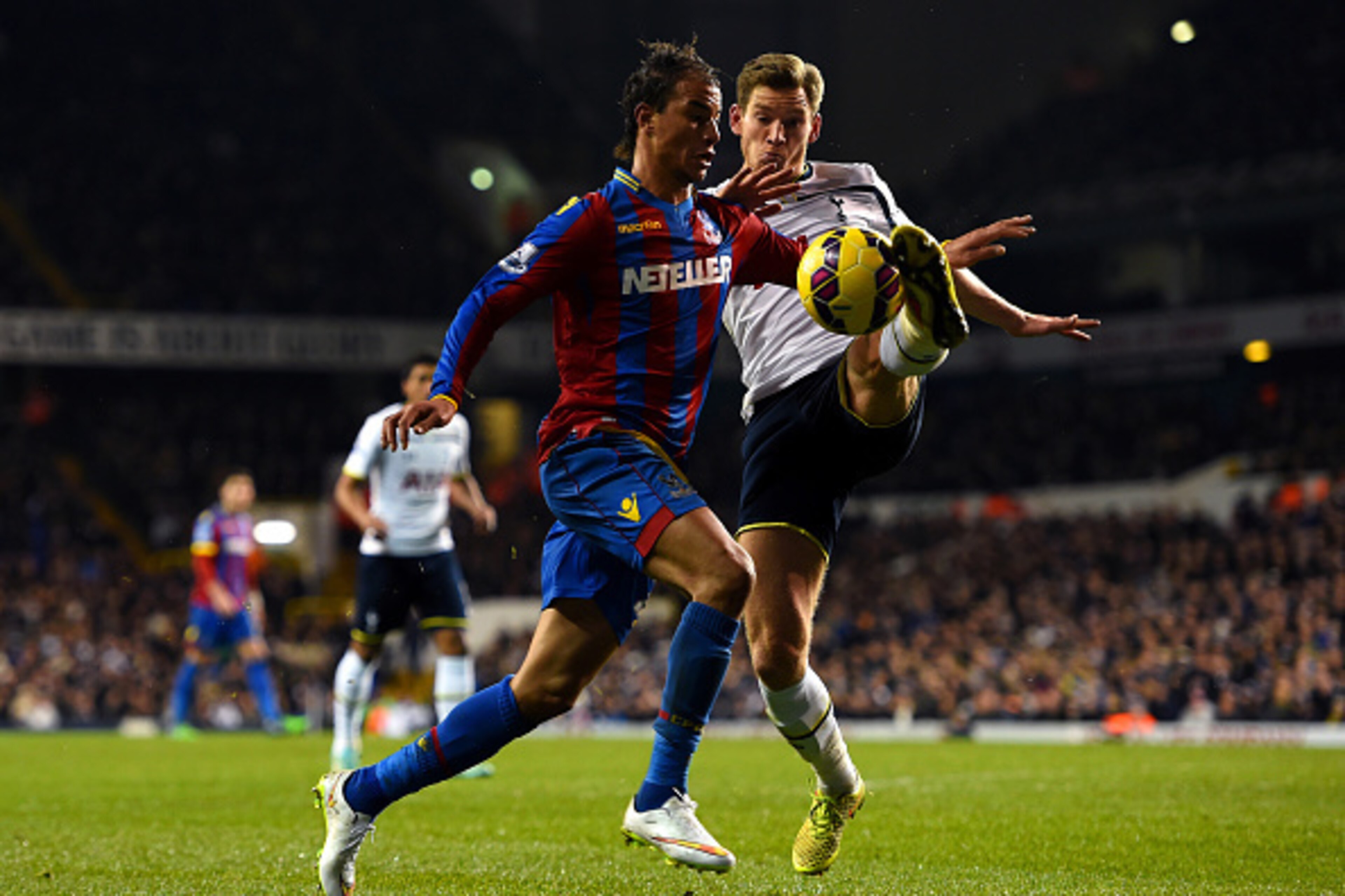 LONDON, ENGLAND - DECEMBER 06:  Jan Vertonghen of Spurs attempts to clear the ball under pressure from Marouane Chamakh of Crystal Palace during the Barclays Premier League match between Tottenham Hotspur and Crystal Palace at White Hart Lane on December 