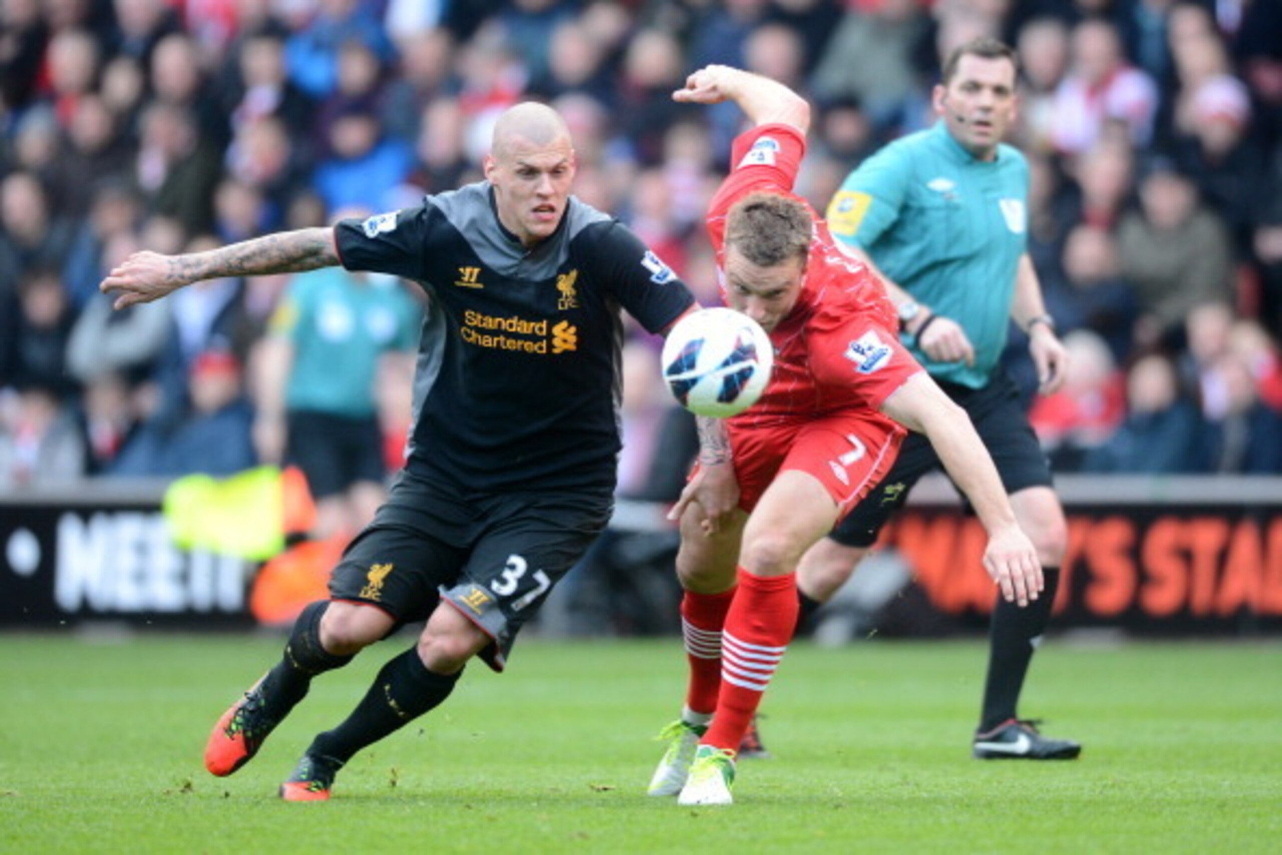 SOUTHAMPTON, ENGLAND - MARCH 16:  Martin Skrtel of Liverpool and Rickie Lambert of Southampton compete for the ball during the Barclays Premier League match between Southampton and Liverpool at St Mary's Stadium on March 16, 2013 in Southampton, England. 