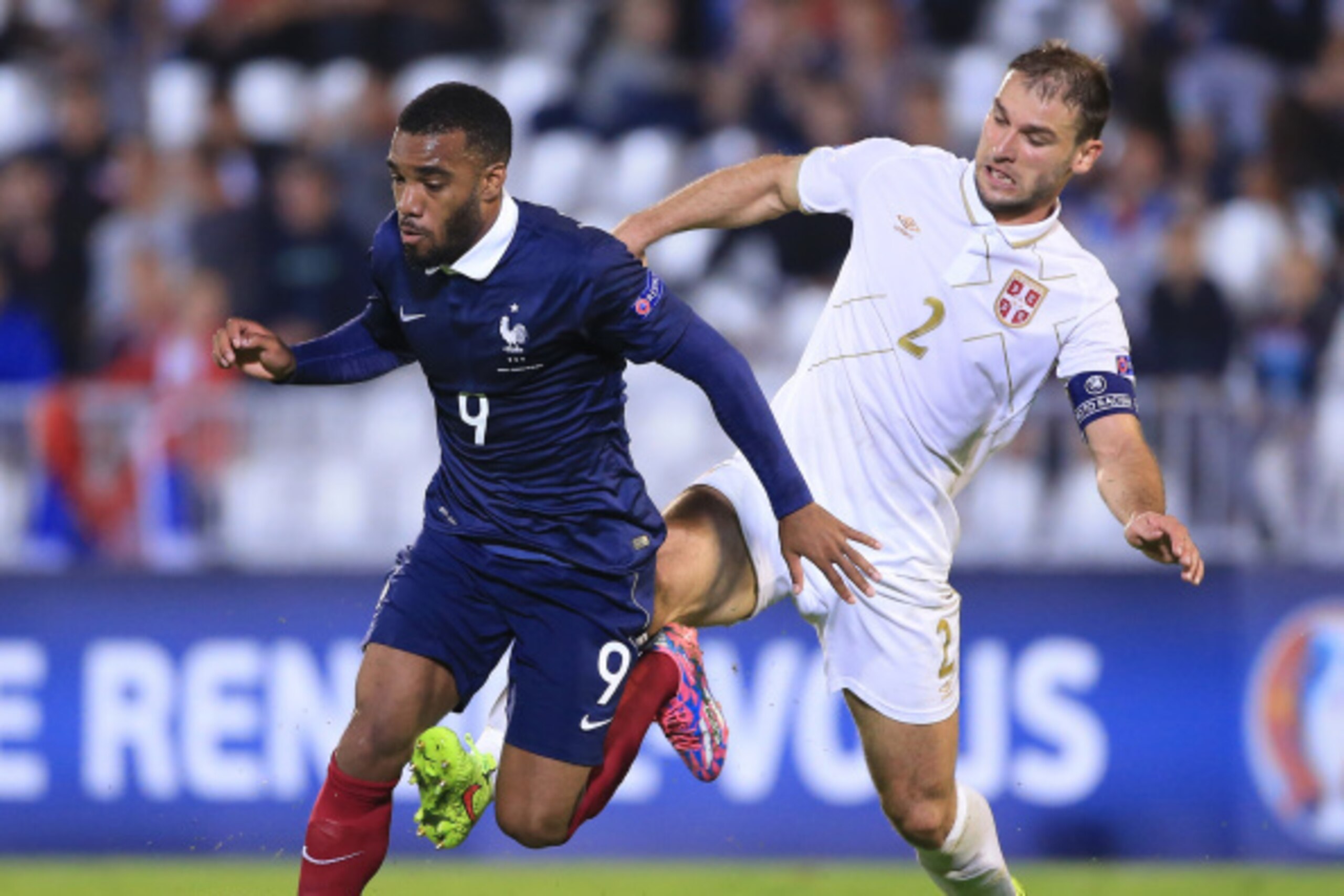 BELGRADE, SERBIA - SEPTEMBER 07: Alexandre Lacazette (L) of France is challenged by Branislav Ivanovic (R) of Serbia during the International friendly match between Serbia and France at the Stadium JNA on September 07, 2014 in Belgrade, Serbia, 2014. (Pho BELGRADE, SERBIA - SEPTEMBER 07: Alexandre Lacazette (L) of France is challenged by Branislav Ivanovic (R) of Serbia during the International friendly match between Serbia and France at the Stadium JNA on September 07, 2014 in Belgrade, Serbia, 2014. (Pho