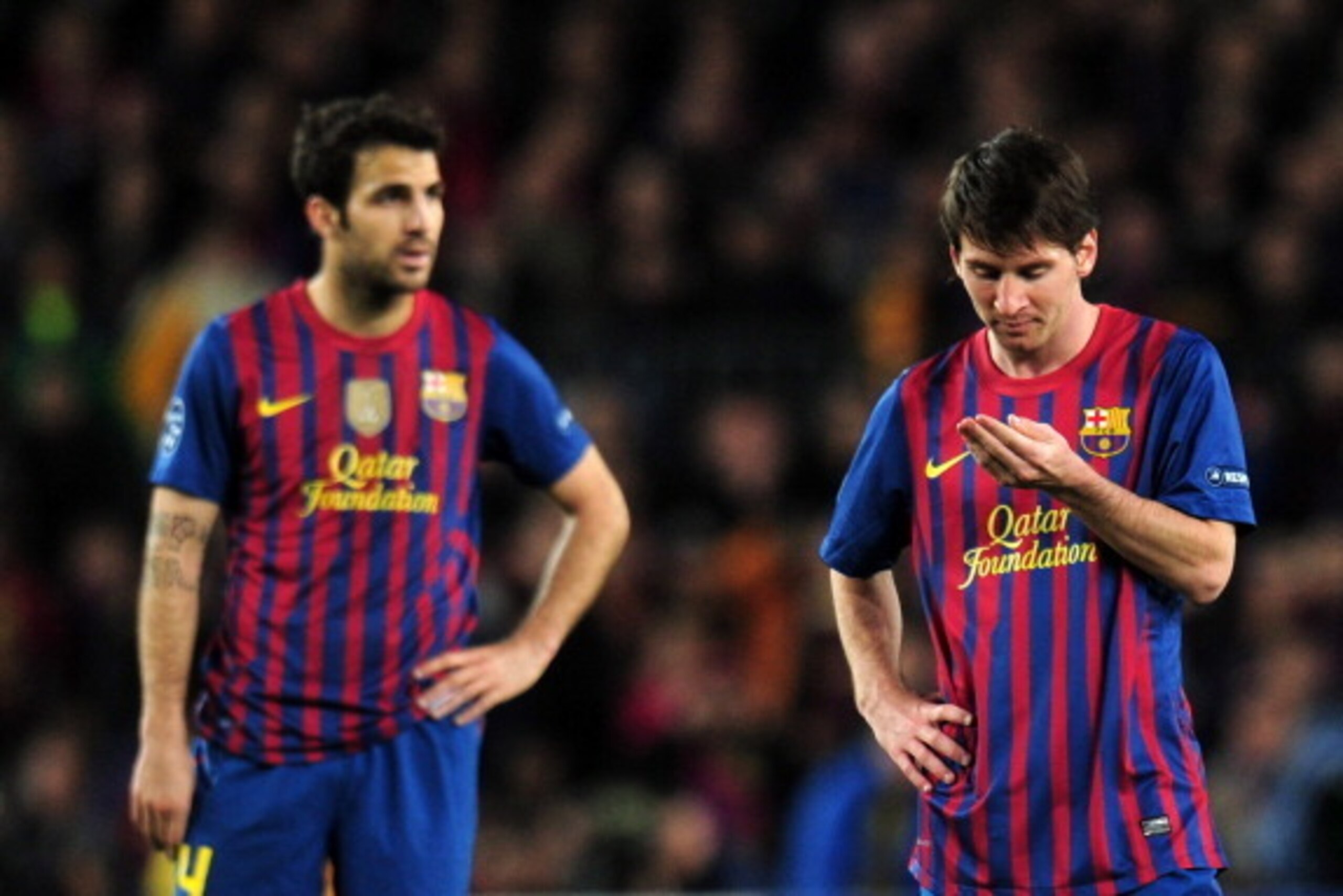 BARCELONA, SPAIN - APRIL 24:  Cesc Fabregas of Barcelona and Lionel Messi of Barcelona look thoughtful during the UEFA Champions League Semi Final, second leg match between FC Barcelona and Chelsea FC at Camp Nou on April 24, 2012 in Barcelona, Spain.  (P