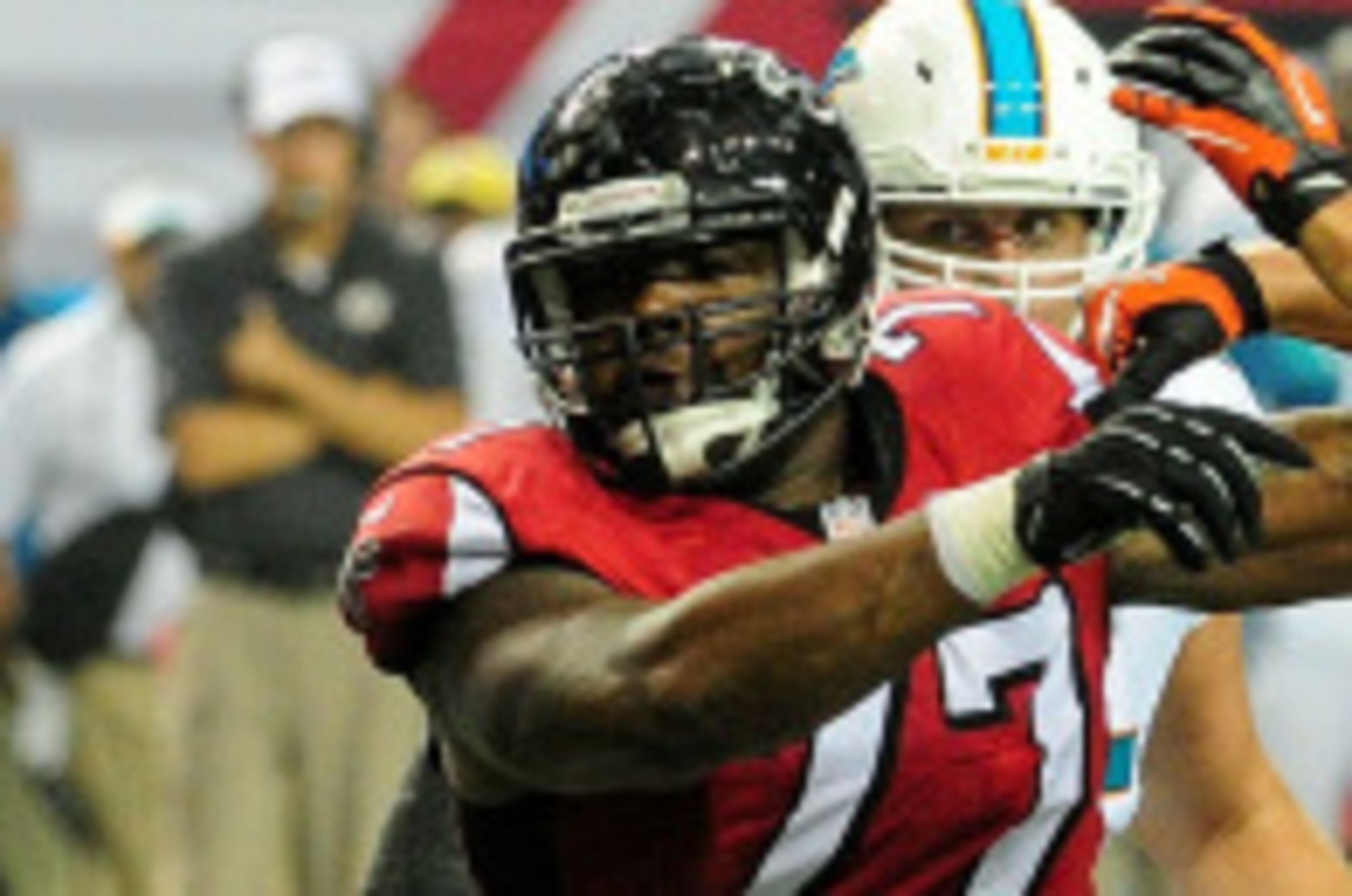 ATLANTA, GA - AUGUST 08: Ra'Shede Hageman #77 of the Atlanta Falcons pushes past Brett Brackett #40 of the Miami Dolphins in the fourth quarter of a preseason game at the Georgia Dome on August 8, 2014 in Atlanta, Georgia. The Falcons won 16-10. (Photo by ATLANTA, GA - AUGUST 08: Ra'Shede Hageman #77 of the Atlanta Falcons pushes past Brett Brackett #40 of the Miami Dolphins in the fourth quarter of a preseason game at the Georgia Dome on August 8, 2014 in Atlanta, Georgia. The Falcons won 16-10. (Photo by