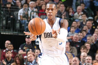 DALLAS, TX -  DECEMBER 20: Rajon Rondo #9 of the Dallas Mavericks passes against the San Antonio Spurs during the game on December 20, 2014 at American Airlines Center in Dallas, Texas. NOTE TO USER: User expressly acknowledges and agrees that, by downloa