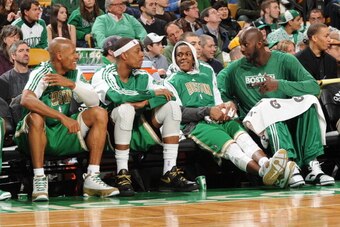 BOSTON, MA - MARCH 13: Ray Allen #20 Paul Pierce #34 Rajon Rondo #9 and Kevin Garnett #5 of the Boston Celtics talk on the bench during a game against the Milwaukee Bucks on March 13, 2011 at the TD Garden in Boston, Massachusetts.  NOTE TO USER: User exp