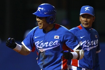 GUANGZHOU, CHINA - NOVEMBER 19:  Jungho Kang #16 of South Korea reacts after he hits a third inning home run while taking on Chinese Taipei during the gold medal baseball game at Aoti Baseball Field 1 during day seven of the 16th Asian Games Guangzhou 201