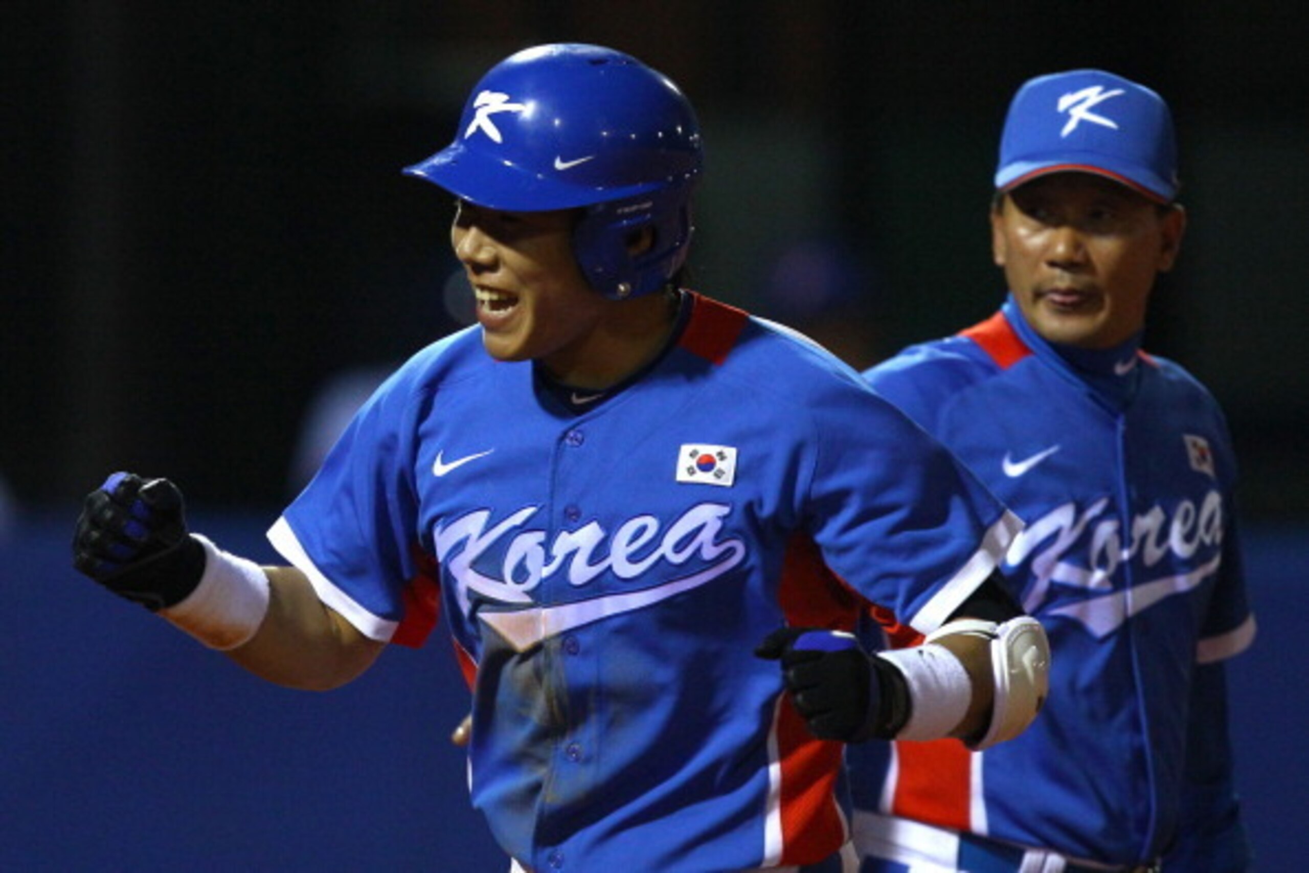 GUANGZHOU, CHINA - NOVEMBER 19:  Jungho Kang #16 of South Korea reacts after he hits a third inning home run while taking on Chinese Taipei during the gold medal baseball game at Aoti Baseball Field 1 during day seven of the 16th Asian Games Guangzhou 201