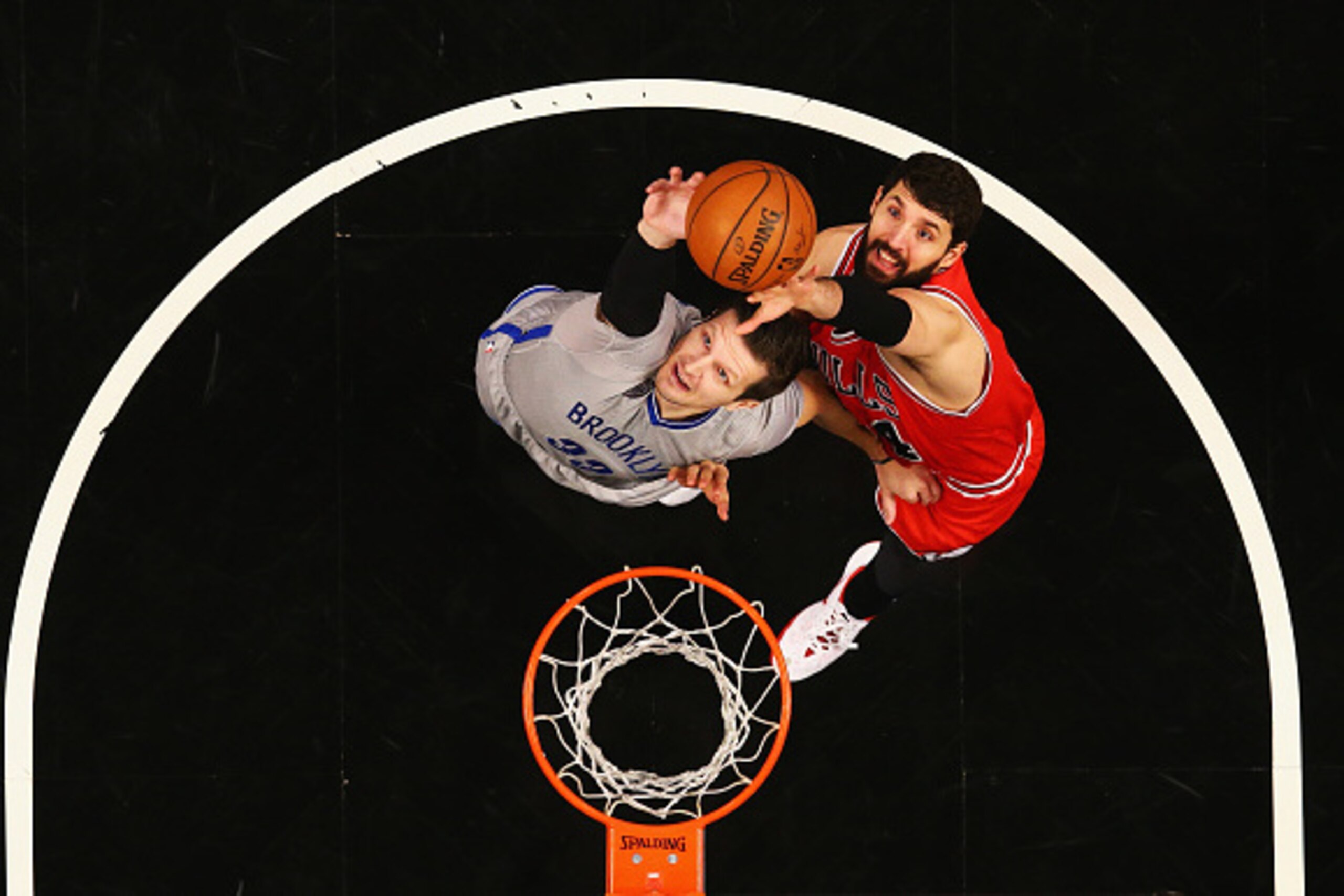NEW YORK, NY - NOVEMBER 30:  Mirza Teletovic #33 of the Brooklyn Nets and Nikola Mirotic #44 of the Chicago Bulls jump for a reboundduring their game at the Barclays Center on November 30, 2014 in New York City.  (Photo by Al Bello/Getty Images)
