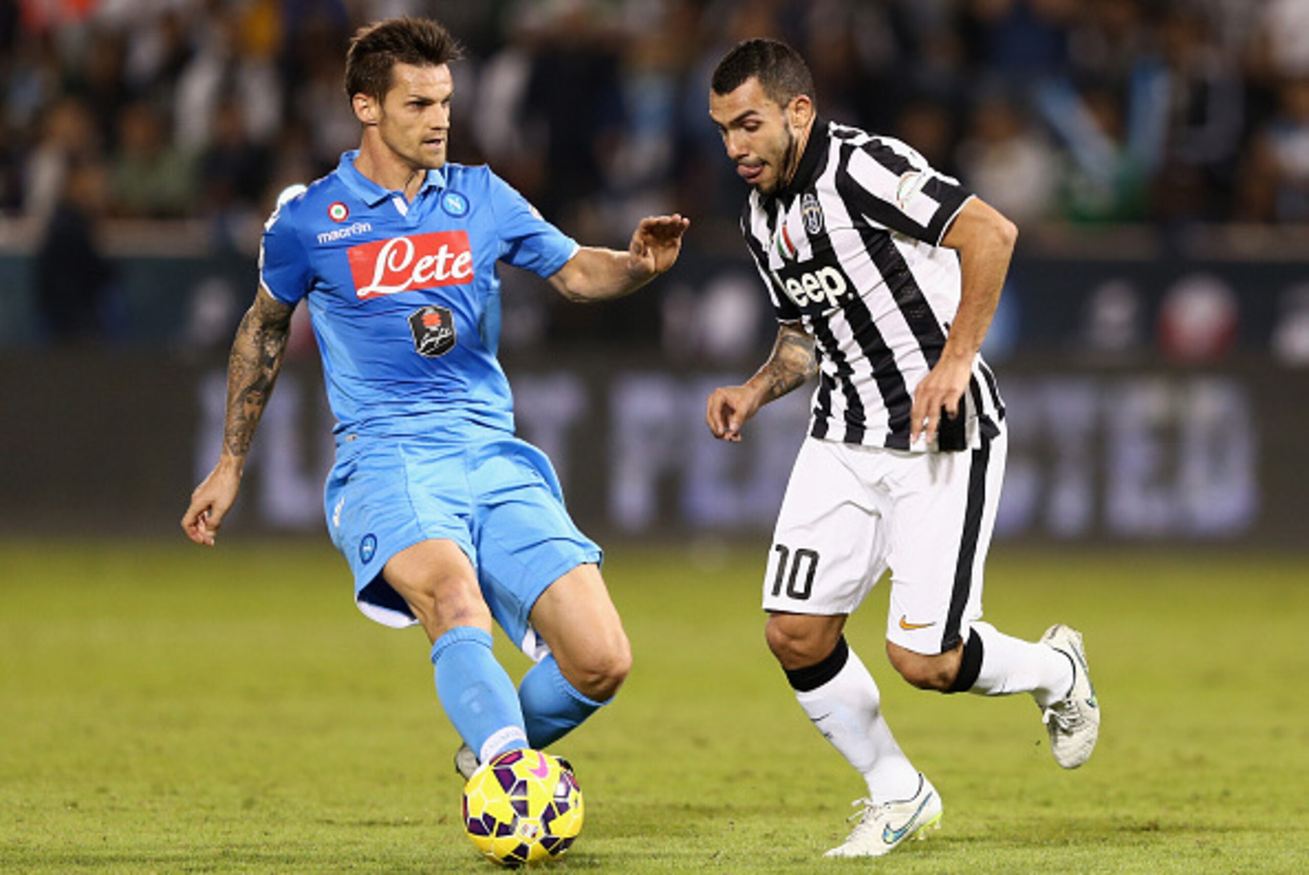 DOHA, QATAR - DECEMBER 22:  Carlos Tevez of Juventus in action during the 2014 Italian Super Cup match between Juventus FC v SSC Napoli at the Jassim Bin Hamad Stadium on December 22, 2014 in Doha, Qatar.  (Photo by Warren Little/Getty Images)