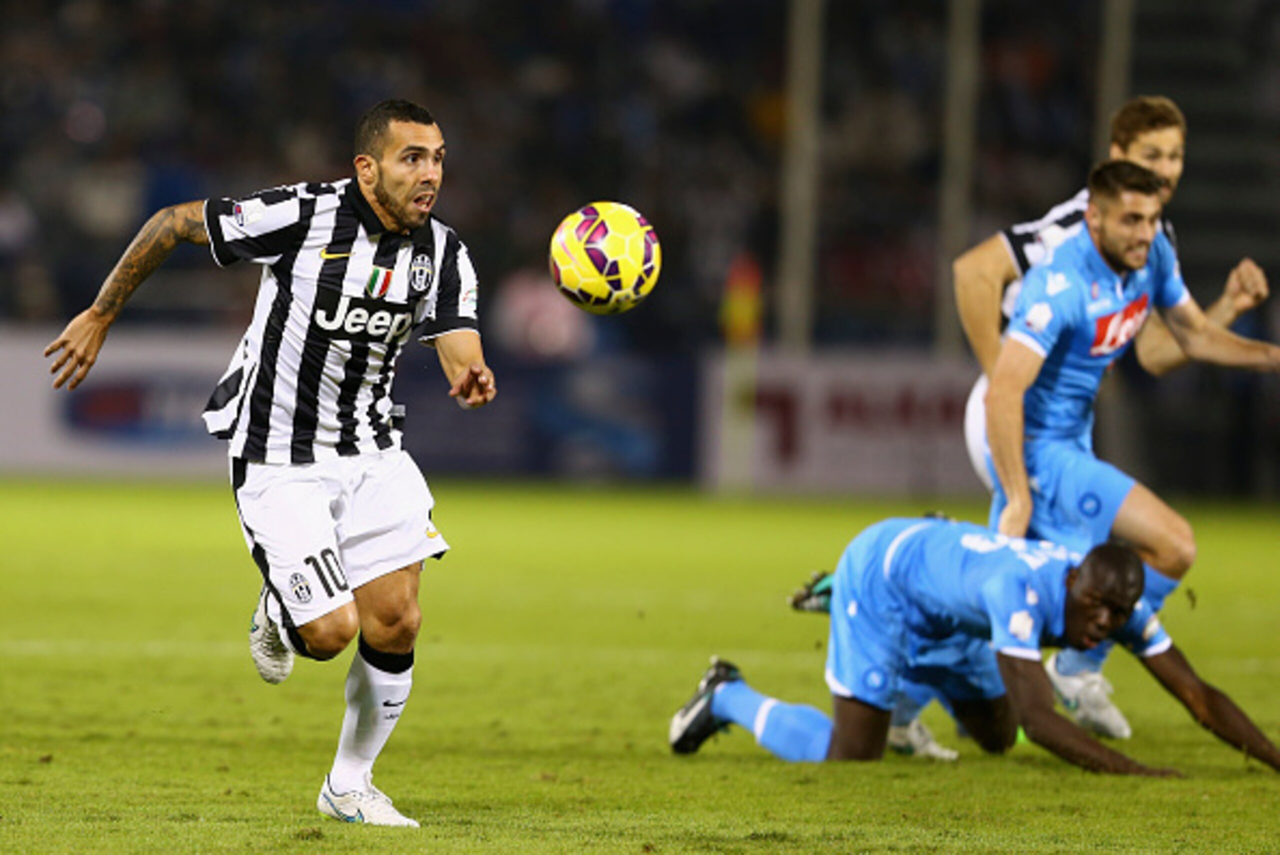 DOHA, QATAR - DECEMBER 22:  Carlos Tevez of Juventus controls the ball during the 2014 Italian Super Cup match between Juventus FC v SSC Napoli at the Jassim Bin Hamad Stadium on December 22, 2014 in Doha, Qatar.  (Photo by Francois Nel/Getty Images)