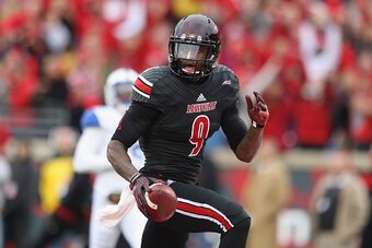 LOUISVILLE, KY - NOVEMBER 29:  DeVante Parker #9 of the Louisville Cardinals runs for a touchdown during the game against the Kentucky Wildcats at Papa John's Cardinal Stadium on November 29, 2014 in Louisville, Kentucky.  (Photo by Andy Lyons/Getty Image