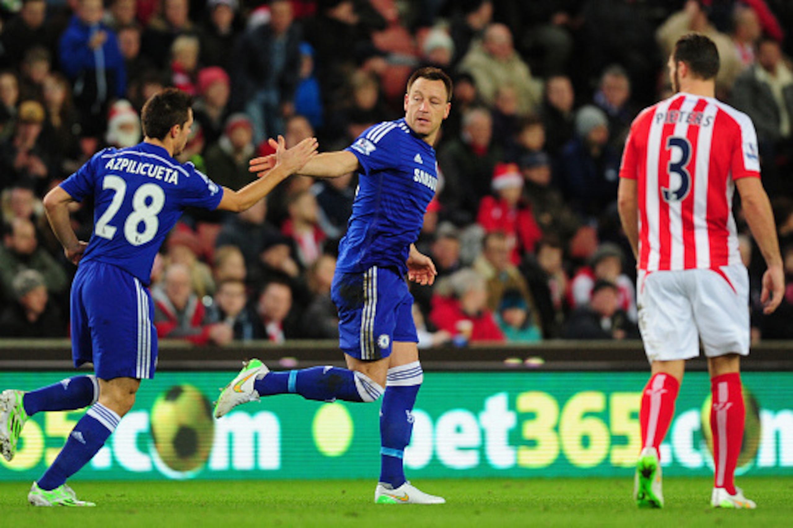 STOKE ON TRENT, ENGLAND - DECEMBER 22:  Chelsea player John Terry (c) celebrates after scoring the opening goal during the Barclays Premier League match between Stoke City and Chelsea at Britannia Stadium on December 22, 2014 in Stoke on Trent, England.  
