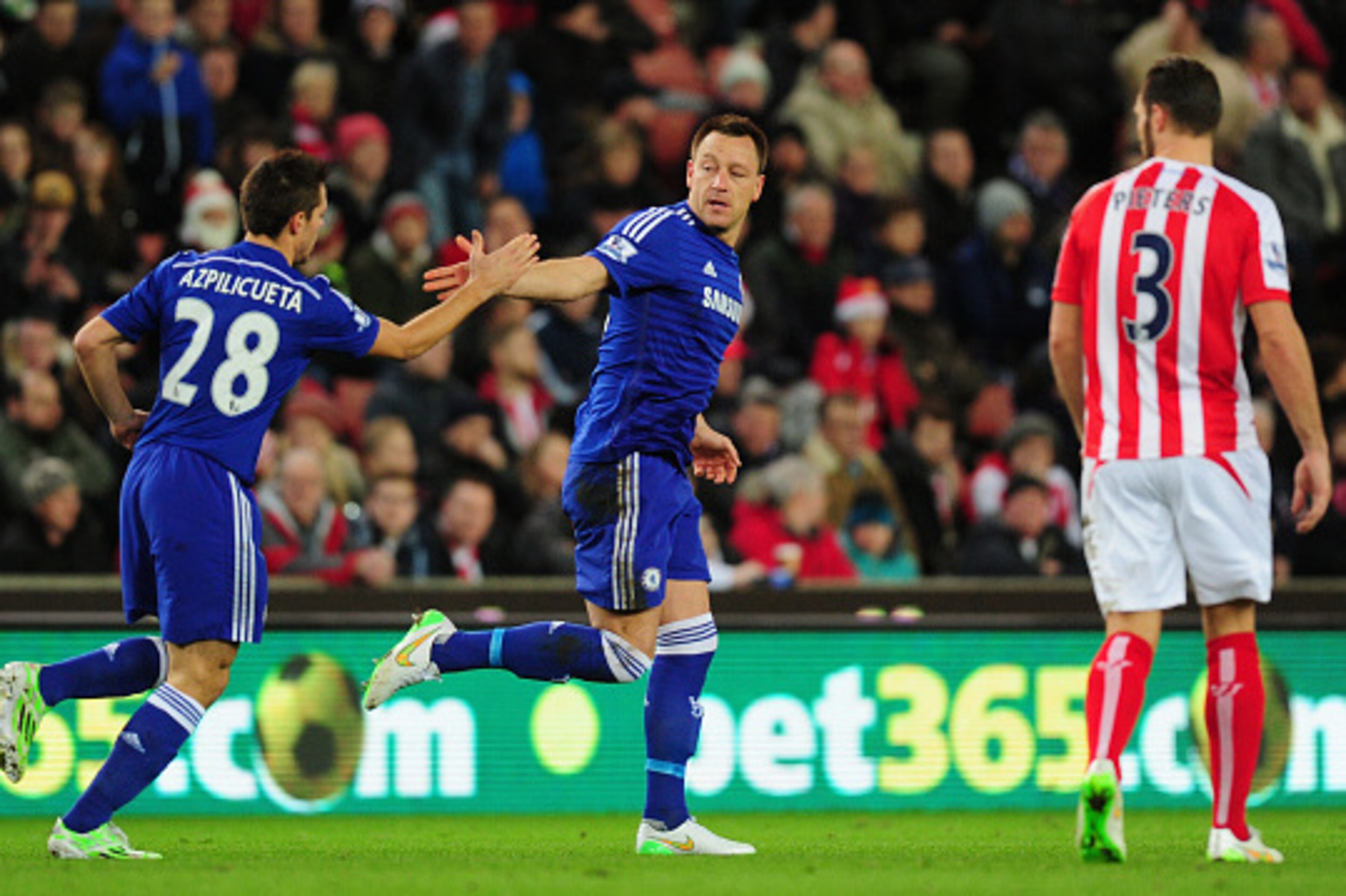STOKE ON TRENT, ENGLAND - DECEMBER 22:  Chelsea player John Terry (c) celebrates after scoring the opening goal during the Barclays Premier League match between Stoke City and Chelsea at Britannia Stadium on December 22, 2014 in Stoke on Trent, England.  