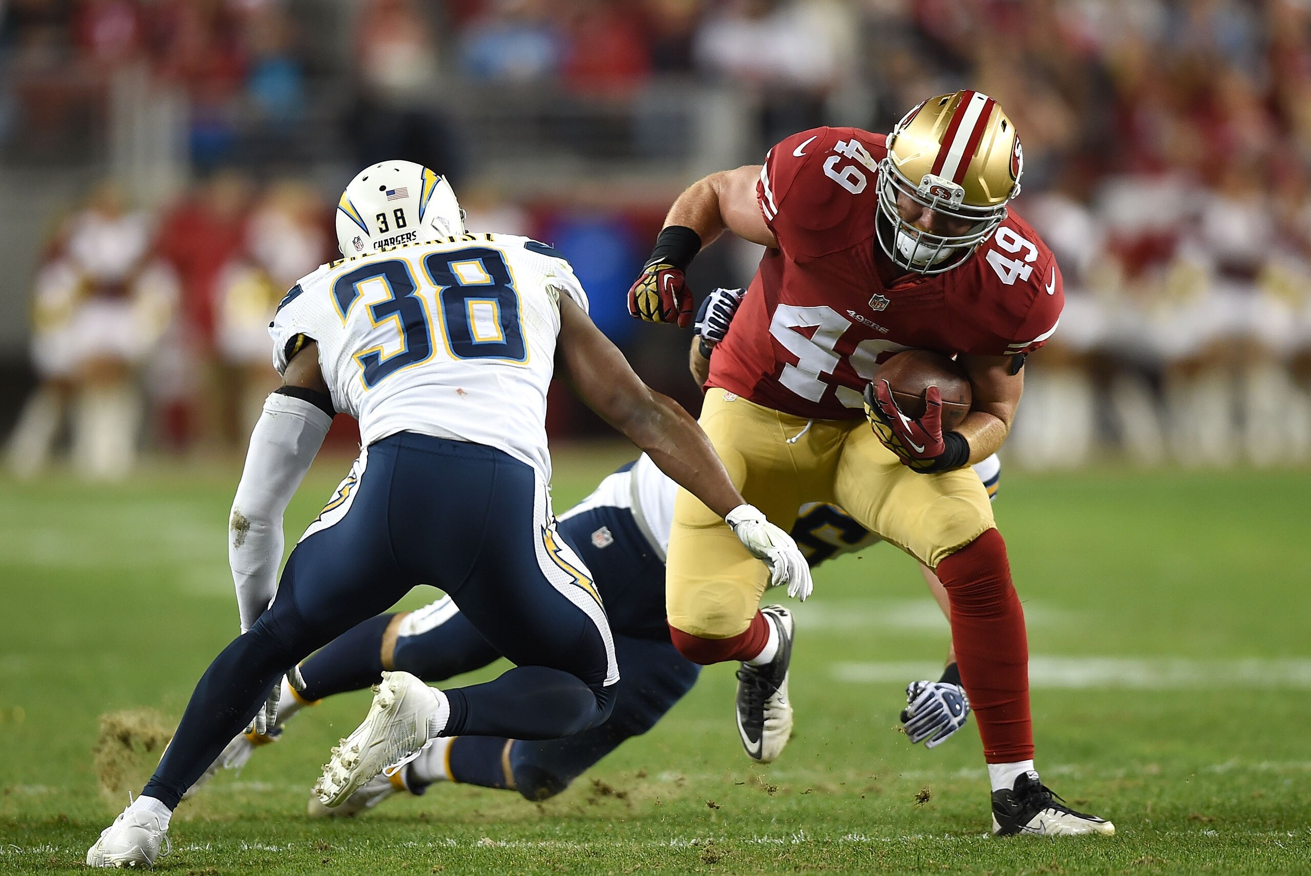 SANTA CLARA, CA - DECEMBER 20: Bruce Miller #49 of the San Francisco 49ers challenges the defense of Marcus Gilchrist #38 of the San Diego Chargers in the first half at Levi's Stadium on December 20, 2014 in Santa Clara, California. (Photo by Thearon W. SANTA CLARA, CA - DECEMBER 20: Bruce Miller #49 of the San Francisco 49ers challenges the defense of Marcus Gilchrist #38 of the San Diego Chargers in the first half at Levi's Stadium on December 20, 2014 in Santa Clara, California. (Photo by Thearon W.