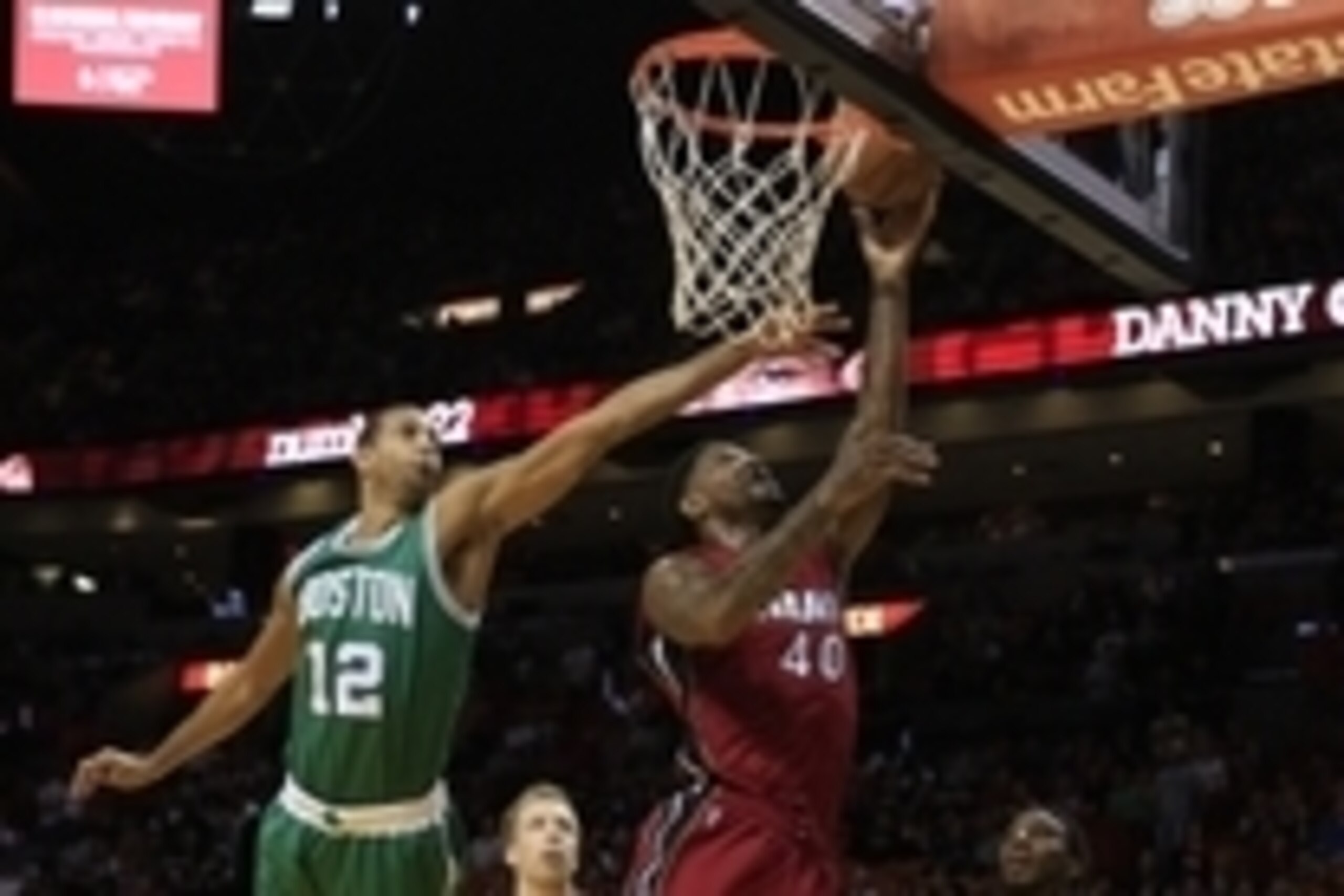 Dec 21, 2014; Miami, FL, USA;  Miami Heat guard Norris Cole (30) shoots the ball as Boston Celtics forward Brandan Wright (12) defends in the first half at American Airlines Arena. Mandatory Credit: Robert Mayer-USA TODAY Sports