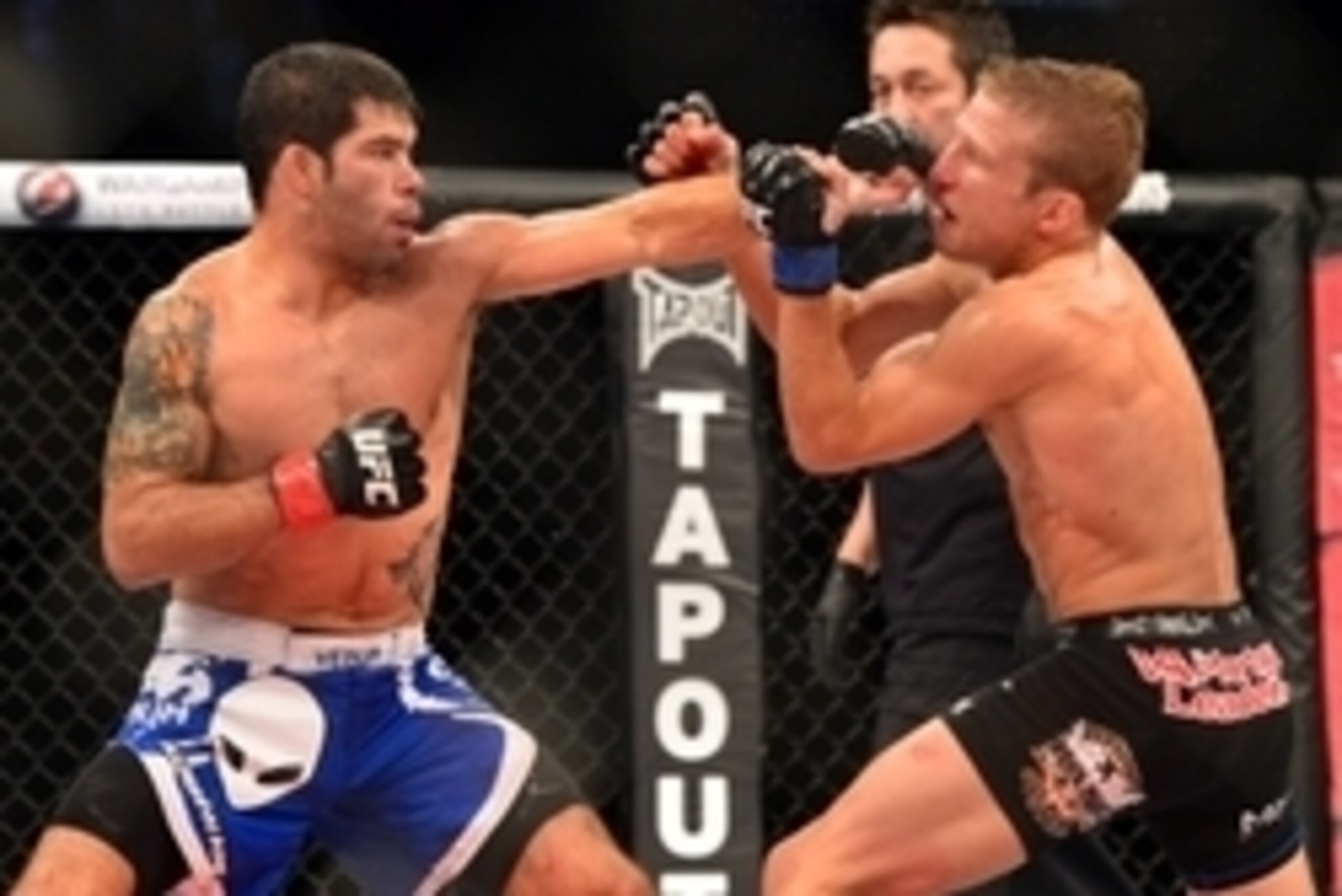 Oct 9, 2013; Barueri, Sao Paulo, Brazil; Raphael Assuncao  (blue shorts) fights against  TJ Dillashaw (black shorts) during UFC Fight Night 29 at Jose Correa Arena. Mandatory Credit: Jason Silva-USA TODAY Sports